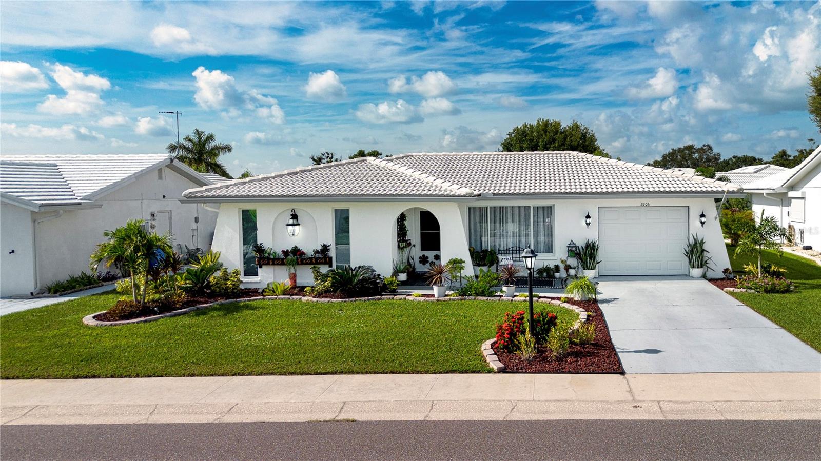 Welcome to River Isles with lowest $60 monthly HOA’s around. Just located along the Braden River. Explore this tucked away, 55 + golf course community. This charming two-bedroom, one-bath home, thoughtfully updated with so much TLC, making it a must-see! Step inside and be wowed by the stunning Mid-Century Modern decor that beautifully complements the home's unique charm. The kitchen is a showstopper, custom made arch over the sink, elegant hand-picked glass and stone tiling with herring bone pattern that reaches the ceiling, and solid surface Crowndale Luxury Quartz countertops. Every detail has been carefully chosen, featuring newer smudge resistant 4 piece appliance suite, the soft close cabinet drawers, to the chic gold faucet fixtures to the ceiling-high cabinetry, with stylish hardware—no expense was spared! The home flows effortlessly, leading you from the living space to the inviting Florida room. French doors opening to the bonus room, plenty of space to entertain family and friends or simply relax with a good book. The powder room features a handpicked antique Italian sink and commode, adding a touch of elegance that perfectly suits the space. Plus, you can rest easy knowing the electrical lighting, recessed fixtures, remote ceiling fans, switch plates, receptacles, and rocker switches, textured ceilings, freshly painted interior walls, updated baseboards throughout the home. You'll love the luxury vinyl plank flooring that runs seamlessly throughout, providing durability and style. The landscaping, which the seller curated, is simply gorgeous and ready to impress. Enjoy your oversized patio—a perfect spot for outdoor relaxation or hosting larger gatherings. Everything is already taken care of for you in this beautifully designed home. River Isles offers amenities such as clubhouse, shuffle board, library, billiards, fitness room, heated pool, and much more. River Isles Golf Club is a favorite spot for the golf enthusiasts - with a 9-hole executive golf course and an option to join a yearly membership with unlimited golf, making it an accessible and affordable option. In addition to the wonderful amenities offered in this community, River Isles is conveniently located with easy access to interstate 75, shopping centers, entertainment hubs, restaurants, airports, bus line, and medical facilities. If you are seeking a community that offers both a peaceful environment yet active community with abundant amenities and activities, River Isles is the perfect place for you to call home. Schedule a showing today! Refer to the “Look what we’ve Done” is a list of all the improvements will be attached in MLS and displayed at the property.