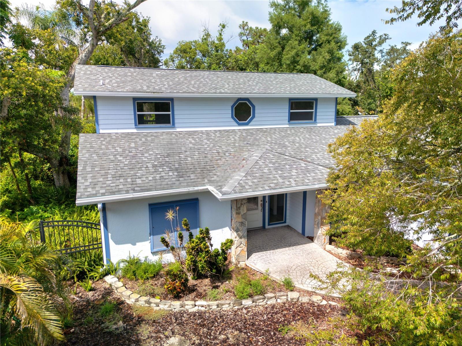 Welcome to 4127 Mallard Drive, a custom craftsman-style home solely built for the present owner. A well-kept gem in the heart of one of Safety Harbor’s most desirable neighborhoods. This 3-bedroom, 2-bathroom home offers 1,784 square feet of comfortable living space on an expansive 10,193 sqft lot—perfect for anyone who values both indoor comfort and outdoor potential. From the curb, the property makes a strong first impression with its classic Florida architecture, mature landscaping, and inviting entryway. As you enter through the front door, you will appreciate the layout, giving you the flexibility for entertaining, working from home, or creating play space. The kitchen is ready for your personal touch—functional now, but brimming with potential for a modern refresh. The big sliding door from the living room leads to a gigantic balcony, overlooking the gorgeous natural landscape in the backyard. Bedrooms are generously sized with the 2nd and 3rd located on the first floor, and the primary bedroom stretching through the whole second floor with the en-suite bathroom and a walk-in-closet, plus a balcony overlooking the backyard. The lot offers plenty of room for a pool, garden, or a playground. It’s a space with real possibilities. Situated minutes from charming downtown Safety Harbor, Philippe Park, and Tampa Bay’s waterfront, you’ll enjoy a blend of Florida small-town charm and easy access to shopping, dining, beaches, and commuter routes. 4127 Mallard Drive is ready for its next chapter—whether you move in as-is or elevate it with your own style, you’ll be getting a solid, well-located home with room to grow.