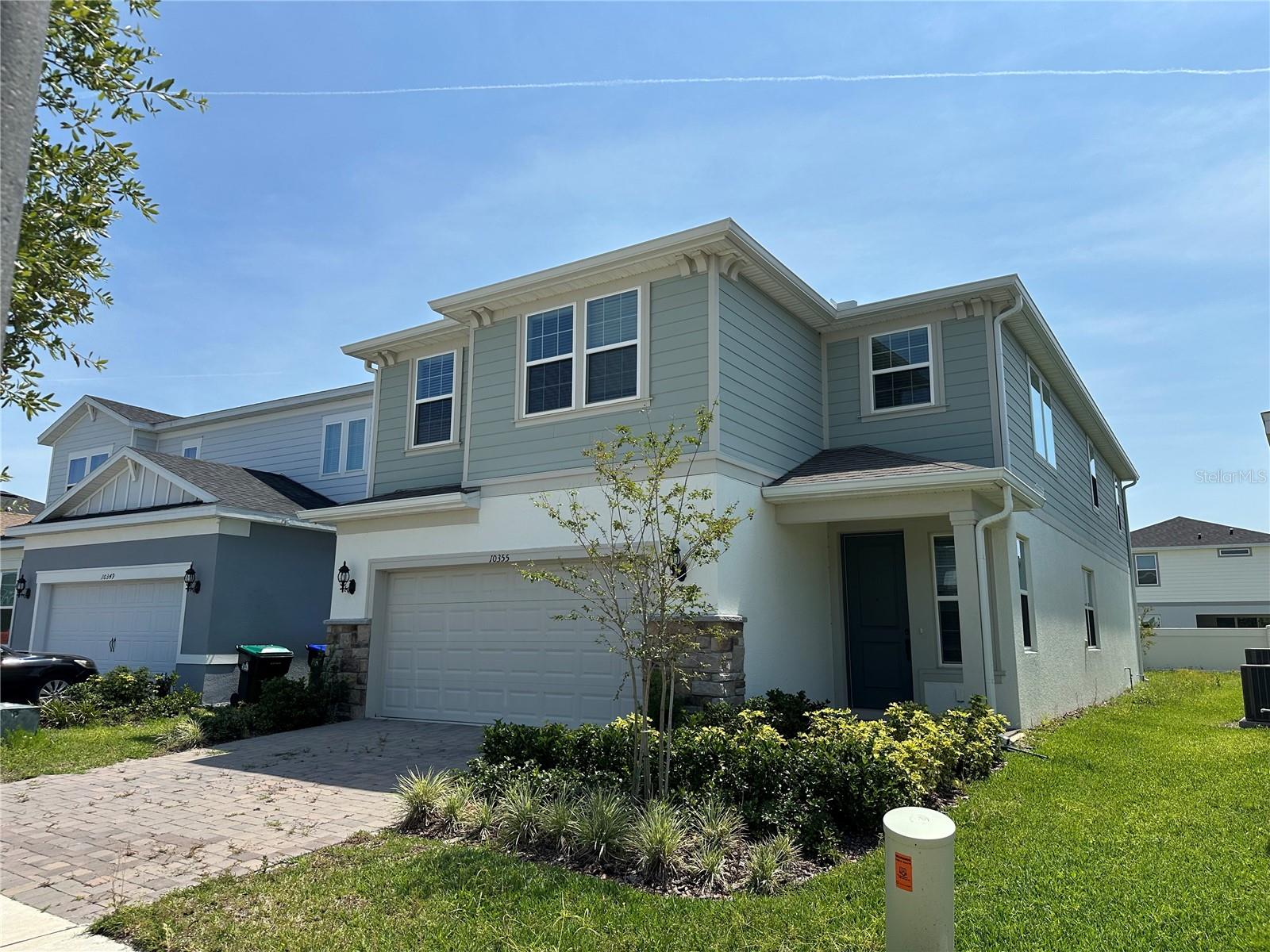 BRAND NEW HOME located in Southwest Orlando! This gorgeous never lived in before home. Situated in the Dr. Phillips, this home is just minutes away from top destinations like Disney Springs, Trader Joe’s, Whole Foods Market, Citibank, Publix, UPS, and USPS—all within a 20-minute drive. just 25 mins away from the magic of Disney World with easy highway access. Equipped with over $70k in builder upgrades, step inside the elegant foyer, you are greeted by a spacious living room and dining room area with cool, luxurious vinyl flooring & modern light fixtures. The adjacent kitchen in this open floor plan home offers sparkling stone countertop, abundant shaker cabinets, all stainless steel appliances, and a pristine tiled backsplash. A spacious bedroom & bathroom are located on the first floor after going through the family room. The large primary bedroom suite offers a walk-in closet with custom built-in shelving, and a private en-suite bathroom with a walk-in shower with a glass enclosure.The laundry room is conveniently located off of the primary bedroom. Upstairs, there are three more spacious bedrooms, and two have en-suite bathrooms. There is a loft upstairs with beautiful lighting that could be utilized as office or entertainment space. Stepping out the back door, there is a covered stone patio space overlooking the large backyard. This home is one you don't want to miss.