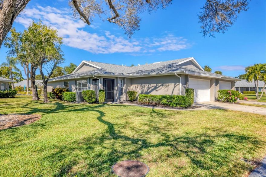AFFORDABLE, SPACIOUS, MOVE-IN READY! Welcome to maintenance-free living in desirable Center Gate Village. This freshly painted 2-bedroom, 2-bath home with a 2-car garage offers a spacious and versatile interior, featuring two separate living areas plus a Bonus Florida room ("under air") that is accessed through sliding glass doors. Enjoy tranquil views of the community pool just beyond the Florida room, creating a perfect spot for relaxing or entertaining. Major updates include a NEW ROOF (2023) and full replumbing, providing peace of mind for years to come. The well-maintained community offers a pool and beautifully kept grounds, all included in the low-maintenance lifestyle. Ideally located near shopping, dining, and medical facilities, with easy access to I-75, and Siesta Key Beach just a short drive west. This home combines comfort, convenience, and location. Whether you're seeking a full-time residence or your winter home in the sun, don't miss this opportunity to enjoy the best of Sarasota living.
