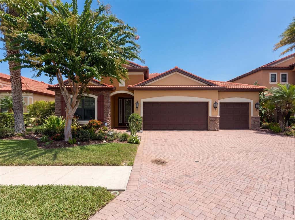 Photo of 2575 Grand Lakeside Drive, Palm Harbor, FL 34684 (MLS # O6427814)