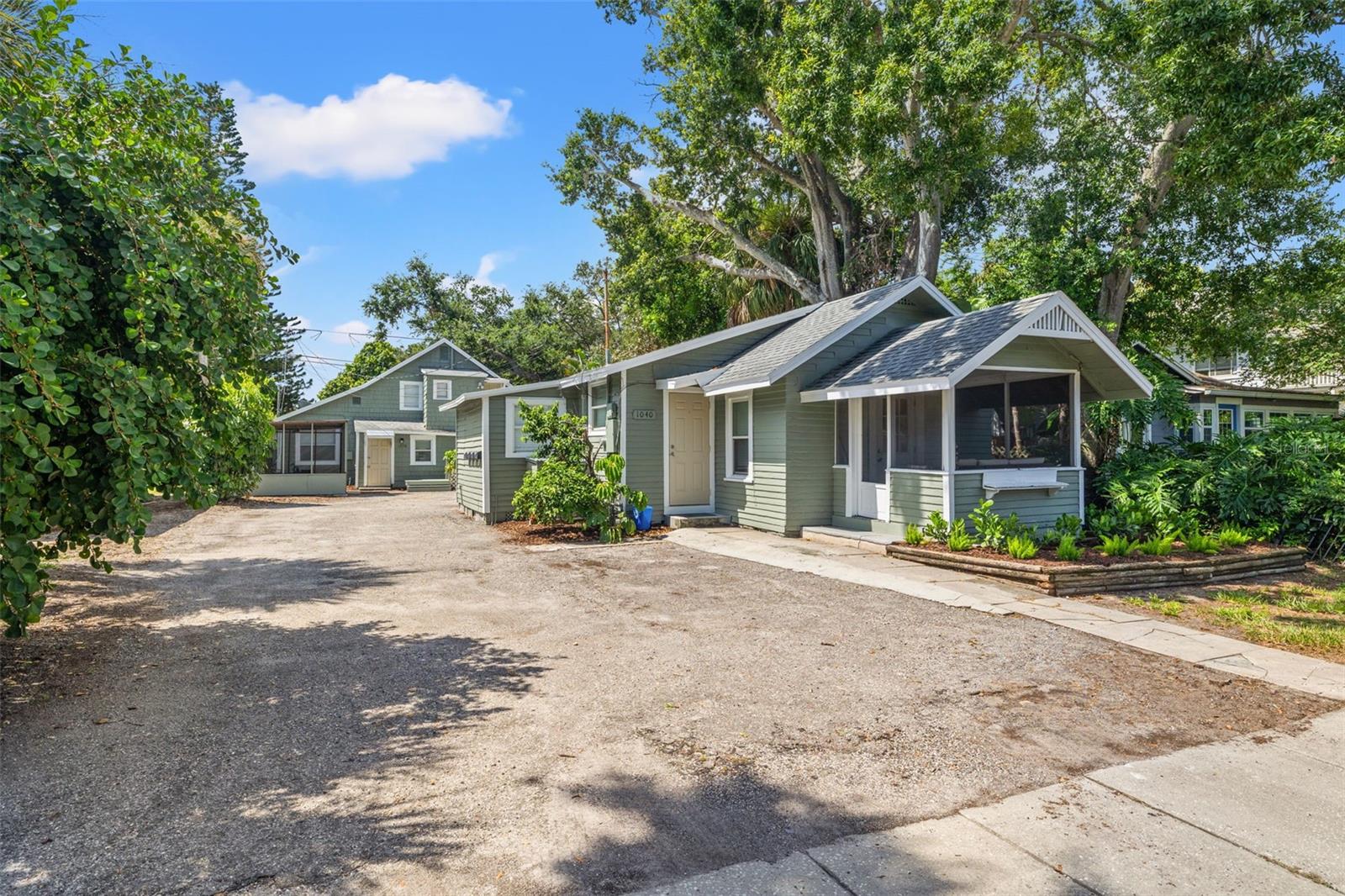 Excellent cash flowing and investment opportunity in St. Pete’s highly desirable Euclid neighborhood, known for its charming brick-lined streets. This unique offering features five total units across three buildings: a single-family bungalow, a triplex, and a detached efficiency, tiny home. The single family home located at the front of the property has 2 bedrooms and 1 bathroom. Behind the single family home sits the two story triplex building where each unit has 1 bedroom and 1 bathroom. The studio is located between the single family house and the triplex building with its own porch. Additional property highlights include a shared laundry room for tenants, a screened-in gazebo for storage, and ample off-street parking - an uncommon convenience in this area. Whether you choose to live in one unit and rent the rest or lease all five for maximum returns, this property is primed for strong passive income. Each unit has received several updates in 2025, and professional property management is already in place and willing to continue. Located less than 5 minutes from Downtown St. Pete and under 30 minutes to both Downtown Tampa and the Gulf Beaches, this property offers tenants the perfect balance of lifestyle and convenience, ensuring consistent demand and easy leasing.