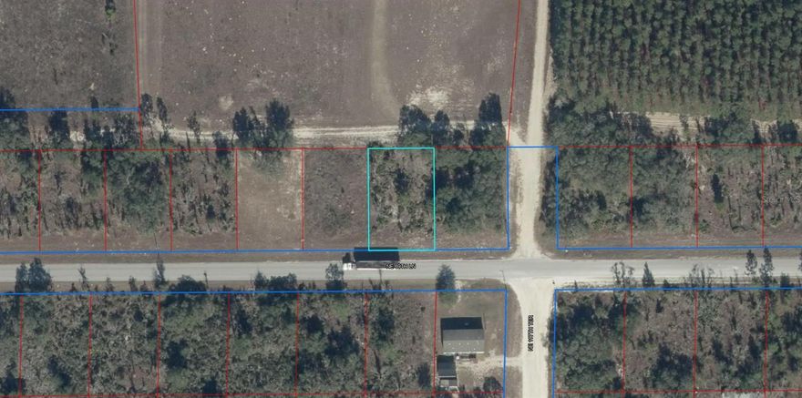 PURE COUNTRY LIVING WITH PAVED ROAD FRONTAGE! This wooded 1/4 acre lot is conveniently located in a rural area between Williston and Bronson. Site built or manufactured homes okay. Easy drive to Gainesville or Ocala.
