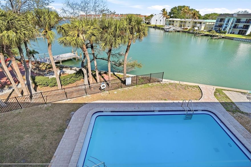Enjoy turnkey waterfront living in this beautifully redone 2-bedroom, 2-bath condo just a few blocks from the sugary sands of Treasure Island. This unique unit features a rare tandem garage that accommodates two cars, a feature rarely found in condos in the area. Step directly from your garage onto your private waterfront patio, where you can enjoy morning coffee, evening drinks, breathtaking sunsets, and even dolphins playing in the water. The community has recently completed gel-coated walkways and a brand-new roof, with additional improvements coming soon, including a new fishing pier, new docks, new gutters, and new front landscaping. Boat slips are available on a first-come, first-served basis, offering easy access to the water. The condo also features a hurricane-rated garage door, and the interior has been beautifully updated throughout, making it truly move-in ready. Whether you’re a boating enthusiast seeking quick water access or a beach lover wanting to be just moments from the Gulf, this property offers the best of both worlds. The rare combination of a turnkey condo, tandem garage, private waterfront patio, and boat access makes this home stand out.
