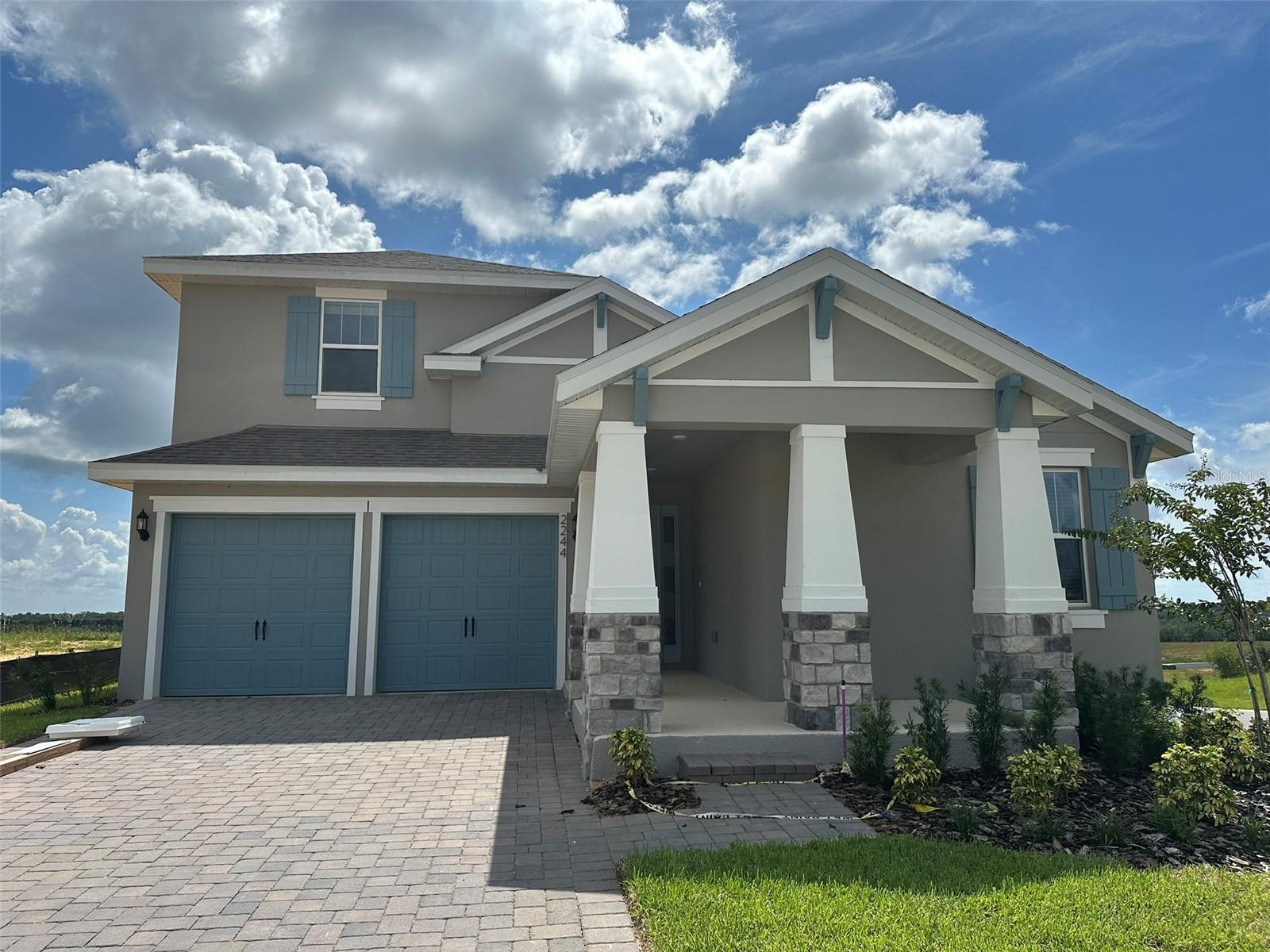Available Mid-August! The Anna Maria with Bonus floorplan offers a spacious two-story home, perfect for growing families, featuring five bedrooms, three and a half bathrooms, and a two-car garage. On the main level, a generous great room flows seamlessly into a well-appointed dining area and a modern kitchen, ideal for entertaining and family gatherings. The primary suite, complete with two large walk-in closets and a private bathroom, is strategically located for added privacy. Upstairs, an additional bedroom, a full bathroom, and a versatile bonus room provide ample space for family members or guests. Nestled in the thriving Hills of Minneola community, this home is conveniently located near major highways, shopping centers, and top-rated schools.