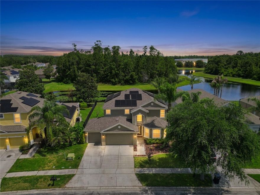 Welcome to this beautifully maintained 5-bedroom, 3-bathroom home with 2,910 sq ft, located in the sought-after gated golf community of Northshore at Lake Hart in the heart of Lake Nona. Perfectly positioned on a premium waterfront and conservation lot, this home offers a rare blend of privacy, scenic beauty, and everyday comfort. Step inside to find wood flooring throughout and a spacious open-concept floorplan designed for both entertaining and daily living. The kitchen features wood cabinetry, granite countertops, and a cozy kitchen nook, all seamlessly flowing into the expansive family room, creating the perfect central gathering space. Enjoy true Florida living from the large covered and screened lanai, ideal for relaxing or entertaining while overlooking tranquil water and lush conservation, with no rear neighbors. The thoughtfully designed layout includes one bedroom and full bath on the main floor, perfect for guests or multi-generational living. Upstairs, you’ll find four additional spacious bedrooms, including the expansive Primary Owner’s Suite featuring a walk-in closet and an ensuite bathroom complete with a garden tub and separate shower, your own private retreat. Additional highlights include a 3-car garage, newer A/C units, a newer roof, and solar panels that help reduce monthly utility costs, delivering both efficiency and long-term value. Residents of Northshore at Lake Hart enjoy an impressive array of amenities including an 18-hole golf course, driving range, resort-style pool, fitness center, tennis courts, basketball court, dog park, community dock, playground, and scenic walking paths, all within a beautifully maintained gated community. Ideally located just minutes from Orlando International Airport, Walt Disney World Resort, and Universal Orlando Resort, this home offers convenient access to all the best of Central Florida, including world-class entertainment, dining, and shopping, while still enjoying a peaceful, nature-filled setting. This is a rare opportunity to own a move-in-ready home in one of Orlando’s most desirable communities, schedule your private showing today.