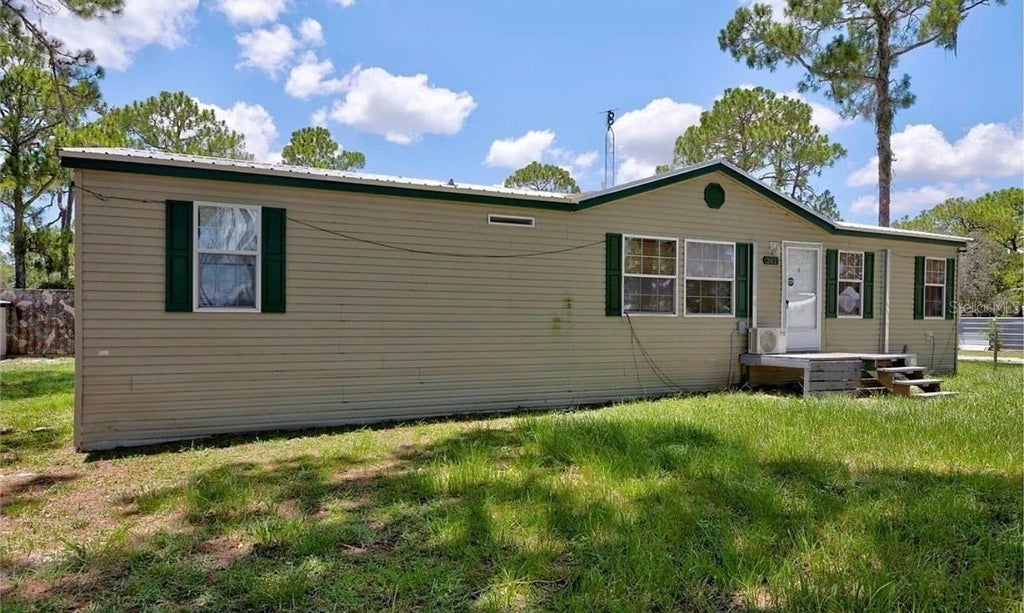 Photo of 201 E Maxanna Blvd, Sebring, FL 33875 (MLS # O6422566)