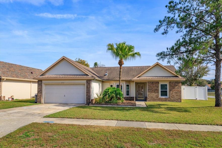 Expect to be IMPRESSED!.   This home features a wonderful spacious OPEN floor-plan, FRESH interior paint, NEW flooring, AMAZING kitchen, BRAND NEW bathrooms with LUXURIOUS finishes, and so much more.  Upon entering you are greeted by the EXPANSIVE vaulted ceiling and the open floorplan.  The KITCHEN is a chefs delight.  GRANITE counter tops, SOLID WOOD cabinetry, PANTRY, and SLEEK appliances.  This home has NEWER windows and sliding doors that provide loads of NATURAL LIGHT.  The family room opens seemlessly to the COVERED & SCREENED IN PATIO that runs the length of the home!  A great area to enjoy these cooler months.  Both the primary bathroom and the guest BATHROOMS have been COMPLETELY RENOVED with amazing finishes.  BRAND NEW tile with marble like appearance in both showers, GRANITE counter tops, NEW mirrors and designer lighting!  All of the BEDROOMS have NEW luxury vinyl flooring - NO Carpeting in this fabulous home.  Finally, the home is located on an EXPANSIVE corner lot, has been fully FENCED with a beautiful vinyl fence, and is located on a quiet CUL-DE-SAC.  This lovely home is centrally located near UCF, the Quadrangle & Locheed Martin. LAWN CARE included.  AVAILABLE to occupy Today!  Welcome Home.