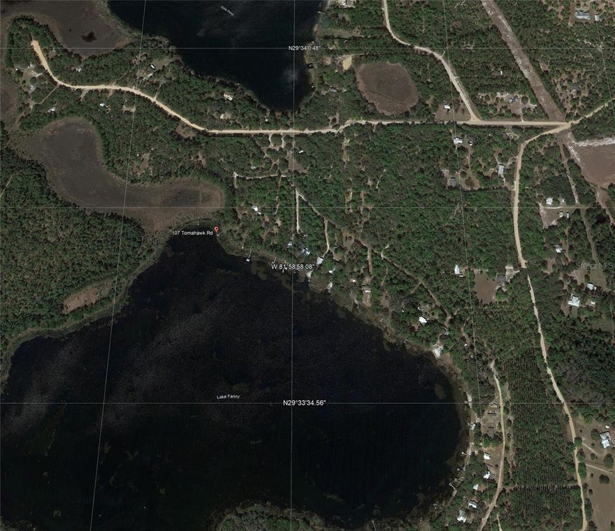 Per Seller :Uncover a rare treasure: two lots totaling 4.8 acres, blending lakefront serenity with versatile land in a tranquil, wooded escape.
Lakefront Lot (3.5 Acres): Craft your dream retreat on this breathtaking parcel, featuring 2 acres of private lake within the 100-acre Lake Funny, renowned as one of Florida’s top bass fishing lakes. With a generous lakefront beach poised for expansion, I envisioned deepening my portion, enlarging my beach, and sinking a boat to create a unique fish habitat. Health challenges shifted that plan, handing you the chance to shape this paradise your way.
Tomahawk Road Lot (1.3 Acres): This bonus lot offers a 50-foot-wide, 1,000-foot-long strip that ends with a 100-foot-diameter circle.
   Only 20 feet wide by 500 feet long (0.25 acres) serves as essential access for you and cordial neighbors, leaving the remaining 30 feet along the first 500 feet, plus the full 50-foot width of the back 500 feet, primed for a fruit tree orchard, lush landscaping, or creative uses. The circle at the strip’s end—once my guest house vision—awaits as a perfect spot for a studio, retreat, or extra space.
Serene Setting: Tucked in a quiet, green haven, this property delivers large-lake-lot privacy with no traffic noise—just nature’s peace. Warm, family-oriented neighbors enhance the welcoming vibe amid forested beauty.
Your Opportunity: At 4.8 acres with the lakefront access, this is a gem for lake enthusiasts or dreamers. My plans paused, but the potential sparkles—deepen the lake, plant an orchard, or build a hideaway. Not ready to build? Camp in your RV or camper up to 120 days per lot annually (potentially 240 days across both) plus unlimited boating on the lake completely unregulated by the County, enjoying full lake access—a rare perk for Florida properties. (Everywhere else in Florida, you have to build your primary structure to park your car on the property, while here you can park your RV and other toys year-round, as long as you don't live on the property for more than 1/3 of the year.)
Seize this unique waterfront retreat with room to thrive. Call  to tour 107 Tomahawk Road and claim your slice of paradise today!