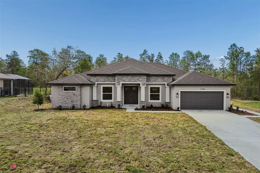 North-facing home with beautiful sunset views from the backyard. Experience elevated living in this stunning brand-new home located in the desirable area of Weeki Wachee, FL.
Featuring 5 spacious bedrooms, 3 full bathrooms, and a 2-car garage, this modern residence offers open and airy living spaces designed for both comfort and style. The open-concept floor plan provides abundant natural light throughout the home
** SELLER IS OFFERING $10,000 TOWARD BUYERS CLOSING COSTS OR RATE BY DOWN. **   * NO HOA *
Step into your extraordinary backyard with endless possibilities — build the pool of your dreams and unwind while enjoying breathtaking sunsets every evening.
This property also includes a sprinkler system in both the front and backyard, and the garage features a sleek, durable epoxy-coated floor, adding both style and functionality.
Located in a peaceful and elegant community, close to restaurants, medical facilities, and excellent schools, with convenient access to the Suncoast Parkway for easy travel to Tampa.