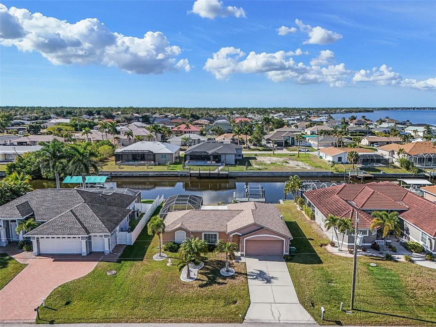 Waterfront Living at Its Finest in Gulf Cove

Welcome to this captivating waterfront retreat nestled on a quiet, desirable street in the sought-after Gulf Cove community of Port Charlotte. Perfectly positioned on a scenic canal with direct access to the Myakka River and onward to the open waters of the Gulf of Mexico, this home delivers the Florida lifestyle buyers dream of—complete with a private boat dock and boat lift for effortless days on the water.

Inside, the bright and airy 1,352 square feet of living space offers three well-appointed bedrooms and two bathrooms, thoughtfully designed for comfort, functionality, and easy living. Hurricane-impact windows and doors throughout provide peace of mind, energy efficiency, and potential insurance savings, while expansive glass fills the home with natural light and tranquil canal views. The sliding glass door on the lanai is protected by a dedicated hurricane covering, ensuring full storm readiness.

Step outside to your private outdoor oasis, where a sparkling pool overlooks the peaceful canal—perfect for entertaining, unwinding, or enjoying sunset swims after a day of boating. With approximately 1,800 total square feet, the home offers seamless indoor-outdoor living designed for the Florida lifestyle.

Ideal for a first-time buyer, savvy investor, or growing family, this property can be sold nearly turnkey, allowing for immediate enjoyment or income potential with minimal setup.

Serene, secure, and truly boater-friendly, this is a rare opportunity to own a slice of Florida paradise where lifestyle, location, and long-term value come together beautifully.