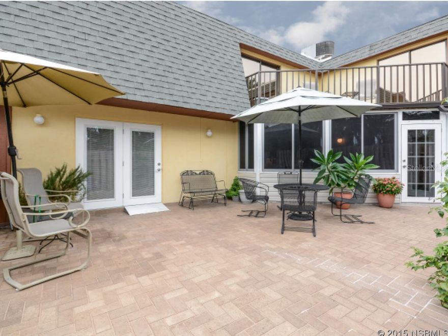 Many recent upgrades in this 3 bedroom 2 1/2 bath, 2 story well maintained town home. Nestled in a quiet corner with garden and water views of a canal leading to the river. Convenient beachside location, and only 2 blocks to the beach! From the private fenced courtyard you enter into a glass and screened in Foyer that opens into living room and kitchen. Beautiful wood cabinetry with modern lighting, wood flooring, new cabinets, spacious built in pantry and Corian counter tops including a breakfast bar. All patio French doors lead out to the courtyard. The Den off the living room also has built in cabinets with a wood tile looking floor. The Master bedroom has 2 large walk-in closets. The Master bath shower and the second bath shower has a lifetime warranty with Bath Fitters. A huge second floor balcony. Wash & Dryer in unit and a storage shed in the courtyard. Conveniently close to shops, restaurants, groceries and churches nearby. MUST SEE! ;LocationDescription: Condo ;Water: City