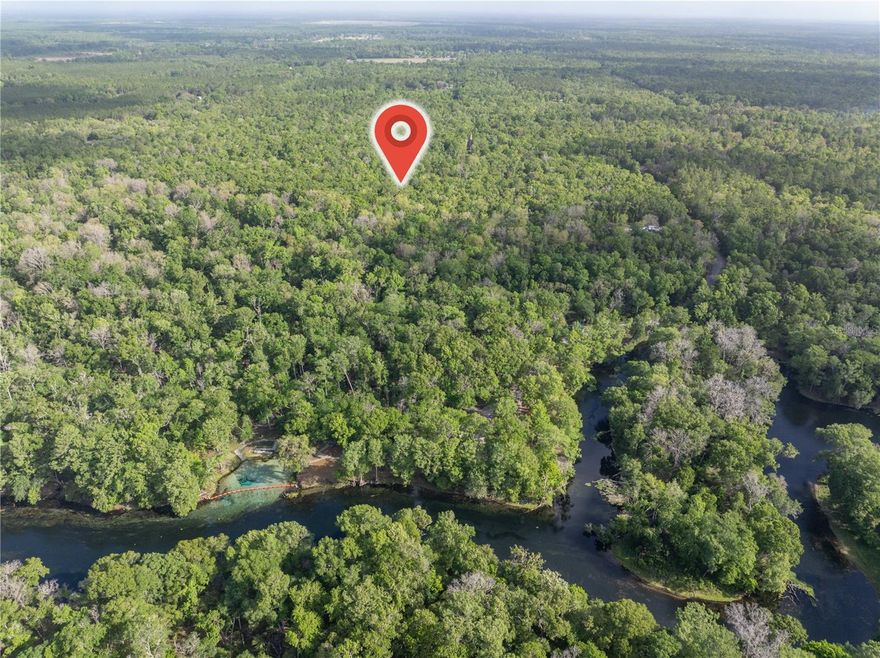 Escape to nature with this gorgeous wooded property tucked away near the pristine Santa Fe River! This beautiful parcel of land can be divided into two 10-acre lots or purchased as a complete 20-acre property (listed separately). It offers privacy, natural beauty, and endless potential for your dream homestead or recreational retreat. Zoned Agricultural, the land provides incredible versatility — perfect for building, farming, bringing horses cows or other animals and enjoying wide-open space. No HOA or deed restrictions! Located right at the very popular Rum Island Springs, you’ll enjoy easy access to some of North Florida’s most desirable outdoor recreation. Spend your days tubing, swimming, kayaking, fishing or boating. It's also not far from the Suwannee River and other well-known destinations like Ichetucknee Springs, Ginnie Springs, Gilchrist Blue Springs State Park, and Poe Springs — making it a prime location for water lovers and outdoor enthusiasts. Whether you're looking to create a peaceful homestead, weekend getaway, or long-term investment, this scenic acreage offers a rare opportunity to own land in an area known for its natural beauty and recreation.