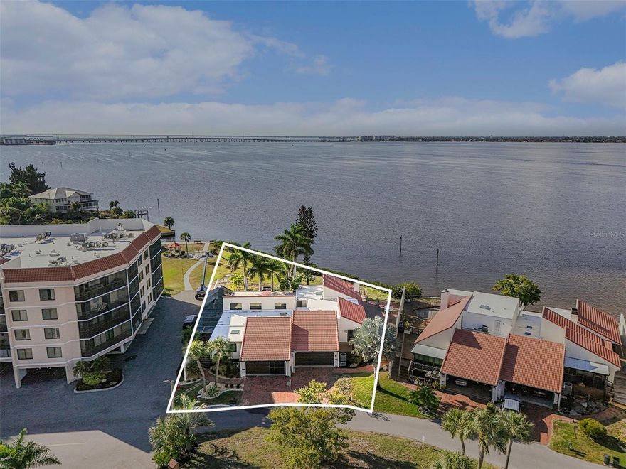 This rare, one-of-a-kind opportunity delivers breathtaking full harbor views and direct waterfront living in the highly sought-after gated community of Emerald Pointe along the Peace River in Punta Gorda, FL. Step outside to your expansive private outdoor oasis: approximately 70 feet of direct water frontage, a spacious upper deck perfect for sunbathing and soaking in panoramic open-water vistas, and a lower deck ideal for fishing, dolphin watching, or simply relaxing by the water's edge. Inside, this stunning 3-bedroom, 2-bath villa with 2-car garage boasts an inviting open floor plan designed for effortless Florida living: Soaring ceilings with exposed beams , Flooded with natural light, Modern laminate flooring throughout, Remote-controlled blackout blinds, Triple sliders opening to stunning water views, Cozy wood-burning fireplace and wet bar in the living room . The bright, spacious eat-in kitchen is a chef's delight, featuring rich wood cabinetry, gleaming granite countertops, stainless steel appliances, a center island with elegant pendant lighting, and a convenient breakfast bar. The luxurious primary suite is a true retreat, with direct slider access to the water views, a generous walk-in closet, and a private en-suite bath complete with a relaxing jetted tub and oversized walk-in shower. Additional bedrooms offer versatility: one guest room opens to a private outdoor nook and shares a full bath, while the third bedroom features slider access to the front deck and easily converts to a home office with a Murphy bed for overnight guests. Recent upgrades ensure move-in perfection: fresh interior and exterior paint, new roof, updated electrical panel, new garage door, refreshed decking, paver driveway, plus inside laundry with deep sink and ample storage. Outdoor entertaining is elevated with a like-new grill and matching refrigerator – and a JET SKI INCLUDED for instant fun on the water!. The HOA covers nearly everything (except electric), including water, sewer, cable, internet, trash, pest control,  landscaping, 24-hour manned security, and full access to resort-style amenities:3 community pools (including heated options), 5 tennis courts + pickleball courts, Bocce ball, putting green, and more, Clubhouse with seasonal restaurant, fitness room, game room, and social activities, Gazebo and park on the Peace River, RV and boat storage, Marina and yacht club facilities. Nestled in a vibrant, boater-friendly waterfront community just minutes from historic downtown Punta Gorda – renowned for its charming shops, fine dining, art galleries, waterfront parks, farmers markets, festivals, and entertainment at Fishermen's Village. This is Southwest Florida living at its finest – low-maintenance luxury with endless recreation right at your doorstep. TURNKEY WATERFRONT VILLA – READY FOR IMMEDIATE ENJOYMENT!. Prime Assigned Dock & 10,000 lb Boat Lift (Slip #16) available – Enjoy seamless, no-fixed-bridges access to Charlotte Harbor and straight out to the Gulf of Mexico for sailing, fishing, and endless adventures!

Don’t let this exceptional opportunity sail away!** Schedule your private showing today and start living the waterfront dream.