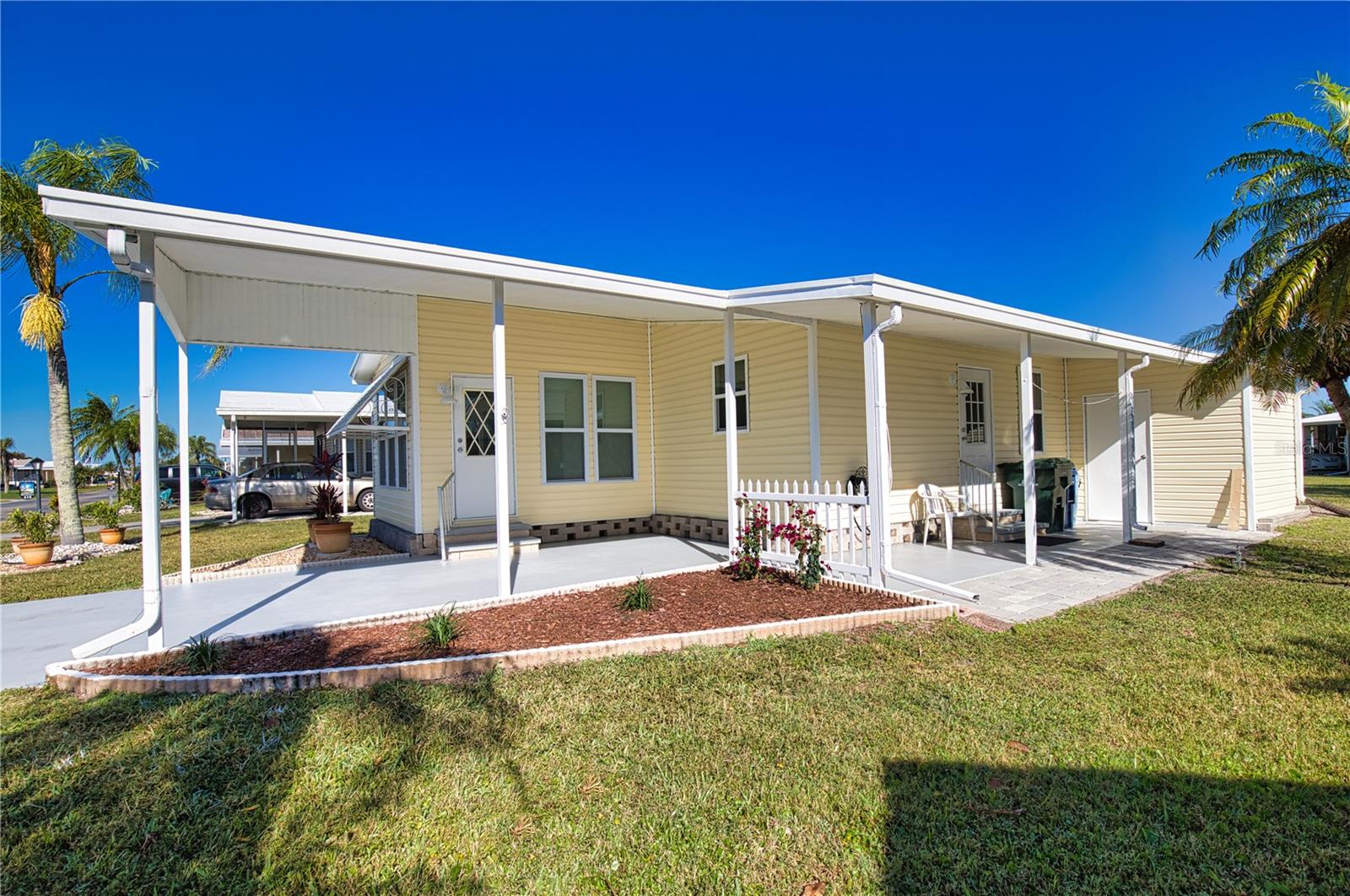 Discover the allure of this charming home nestled on a tranquil street in a vibrant 55+ community—your gateway to a slice of paradise! The inviting kitchen and dining room combination makes entertaining a joy, effortlessly transitioning to a cozy living room that opens to the delightful Florida Room, perfect for basking in the sunshine or hosting gatherings. The guest bedroom exudes comfort, complete with a spacious walk-in closet and a conveniently located bathroom just steps away. Meanwhile, the primary bedroom is a serene retreat featuring a generous walk-in closet and an exquisite ensuite bathroom that has been thoughtfully updated. This home boasts essential upgrades, including sturdy plywood subflooring, elegant waterproof vinyl flooring, new windows to let in the light, and fresh vinyl siding that enhances its curb appeal. With a newly installed vapor barrier and insulation, your comfort is assured year-round. Offered turn-key, this home invites you to personalize it and savor the incredible lifestyle that La Casa has to offer. Don't miss out on making this dream home your reality! La Casa boasts 974 homes nestled among a variety of native trees with spacious common grounds surrounding our eight lakes. The ultimate lifestyle on Florida’s Gulf Coast is located between Sarasota and Fort Myers and is a boaters dream with access to the Gulf of Mexico. It is convenient for shopping, sightseeing, golfing, fishing, and boating, as well as all the culture and elegance the Southwest Florida area is noted for. Residents and visitors enjoy the warmth of Southwest Florida winters in a relaxed and unhurried environment far removed from the hustle of Florida’s east coast. You’ll be surrounded by hundreds of palms reaching for the sky and beautiful mature lush landscaping which demonstrates the utmost level of care our property receives from residents and management. La Casa may have the best pools in the area. Our extremely large, 40 X 60-foot swimming pool is our crown jewel and that is kept at a perfect 87 degrees. Our smaller 20 x 40 pool is quietly nestled between the clubhouse and the Activity Building. Both pools have adjacent hot tubs which are ideal for soaking muscles that are tired from golfing or tennis. Wireless Internet (Wi-Fi) is available at the Clubhouse, Activity Building, and Recreation Hall area where these pools & spas are located, so you can catch some rays while you catch up on your email! Sound enticing? La Casa is a friendly, family community. You will be away from the hustle and bustle except when you want to be part of it. When you leave our gates, North Port is only 1.5 miles from the city center, where you will find every kind of retail store and service you could need. Come for a visit to this self-contained oasis and see for yourself why La Casa is the ultimate destination for both snowbirds and year-round.