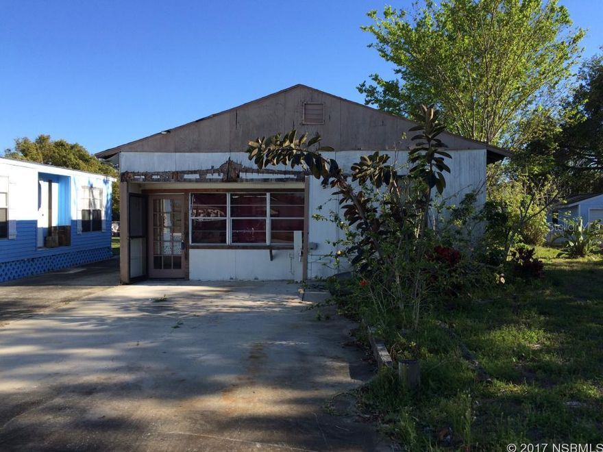 This canal front lot has a seawall and boat house with a rare private boat launch (shared with the neighbor). A concrete pad is already in place for whatever residence you wish to construct. It currently has a building on the property so there is no impact fee. Minutes by boat to Mosquito Lagoon and a short drive to shopping in Edgewater and NSB. THE BUILDING HAS NO VALUE and is being sold for land value only. ;Water: City