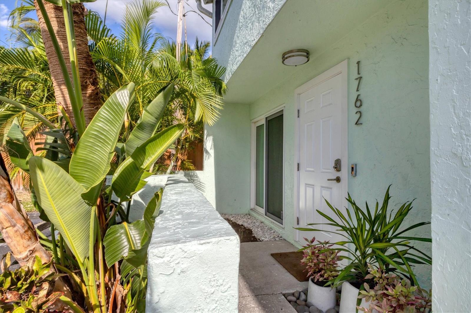 Located just steps from the bridge to the world-famous Siesta Key Beach, this beautifully updated two-story end-unit townhouse offers 2 bedrooms, 1.5 bathrooms, and approximately 1,042 square feet of comfortable living space. The first floor features an open layout with a bright living room, dining area, and a modern kitchen equipped with stainless steel appliances and quartz countertops. A private screened patio overlooks a peaceful courtyard and provides easy access to the community’s heated pool—perfect for relaxing or entertaining.
Upstairs, the spacious primary bedroom offers generous closet space and shares a full bathroom with the guest bedroom. Additional conveniences include in-unit laundry hookups and two assigned parking spaces. Originally built in 1980, the home has been fully renovated with updated wiring, plumbing, porcelain tile flooring, and stylish modern fixtures.
With only 15 units in the complex and a prime Sarasota location close to shopping, dining, and beautiful Siesta Key, this property is ideal as a full-time residence, vacation getaway, or investment opportunity. Don’t miss your chance to own a move-in-ready home in one of Sarasota’s most desirable areas.