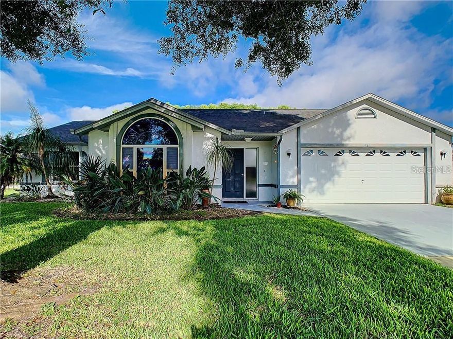 STUNNINGLY APPOINTED RANCH HOME WITH MATURE LANDSCAPING AND NEW ROOF (2011) LOCATED LESS THAN 10 MINUTES FROM PORT ORANGE BEACH! This home is situated on an oversized corner lot and there are no HOA fees! Step inside this picturesque home and you will be welcomed by an open concept floor plan with tons of natural light. The kitchen area you will find directly left of the foyer, which features upgraded stainless steel appliances, oversized voluminous windows, high ceilings, and a plethora of counter space. A very useful serving bar that separates the dining area from the kitchen. The dining area, along with the living room are both considered “open concept” and natural light pours inside beautifully from both front and rear of this home. The family room showcases a serene view of the lush backyard. Additional features include a fireplace, large skylights that adorn the ceiling, updated light fixtures, and well-situated & easy to maintain ceramic tile floors. Two bedrooms are located on one side of the home with their own bathroom. The master suite is secluded on the other side of the home with a gorgeously updated en-suite bathroom that boasts a spectacular amount of natural light. The extremely private and exuberant backyard is fenced in, and undoubtedly perfect for small children or pets! The rear of this home also possesses an exquisite patio area perfect for a fire pit, al fresco dining, or just relaxing in general. This fabulous home must be seen to be appreciated, do not miss out! ;Water: City