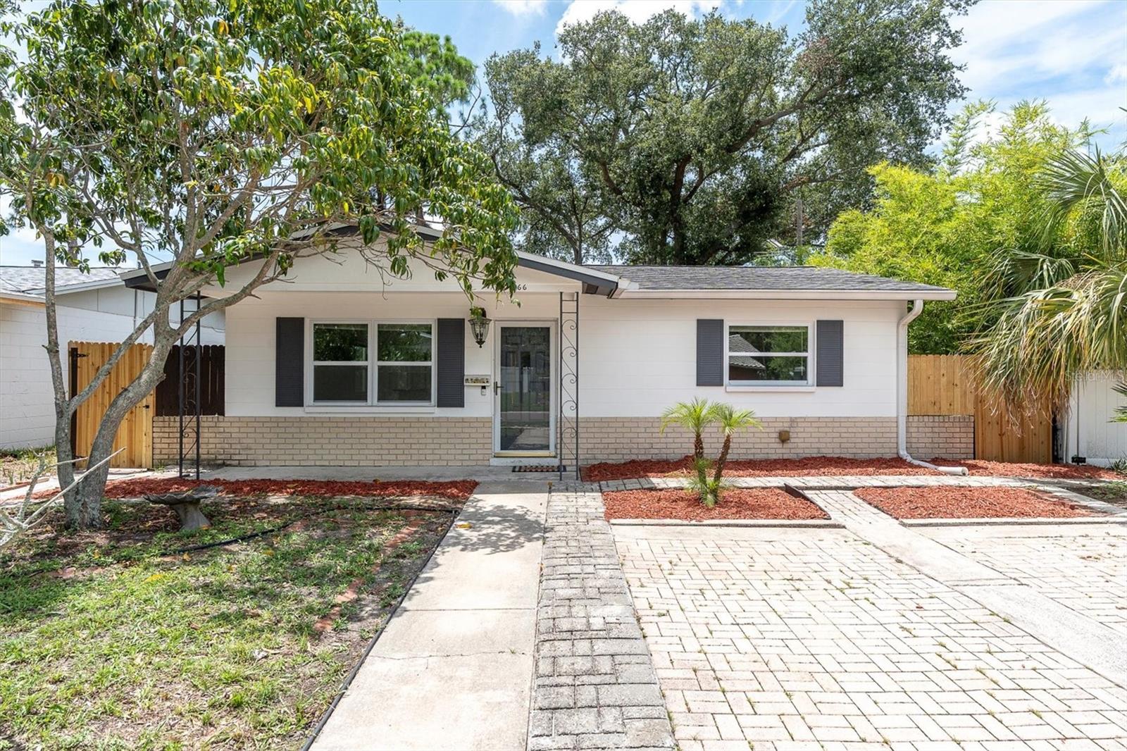 Move-In Ready with Modern Updates! Welcome to this beautifully maintained 2-bedroom, 1-bath block home nestled in a quiet, established neighborhood in St. Petersburg. With ceramic tile flooring throughout, this home offers durability, style, and easy maintenance. The gorgeous kitchen is equipped with granite countertops, deep stainless steel sink, newer cabinets, and updated hardware and fixtures, creating a sleek and functional cooking space.
The bathroom has been tastefully updated and includes a modern vanity cabinet, granite counter, with walk -in shower. The interior laundry room features a convenient utility sink. Recent 2025 post-storm upgrades include brand new drywall, interior paint, lower kitchen cabinetry, bathroom vanity, doors, freshly painted back porch flooring, & new ceiling fans in all bedrooms & porch. Enjoy peace of mind with major system updates, including a Trane AC (2022), double-pane windows, newer doors, and a screened back porch with updated lighting and fans. The roof was replaced in 2018, completing the list of significant structural improvements.
A fully fenced oversized backyard offers privacy and space for entertaining, with alley access for recreational vehicles, boats storage. Located minutes from local parks, dining, and Gulf beaches—this home is the perfect blend of quality, comfort, and convenience.