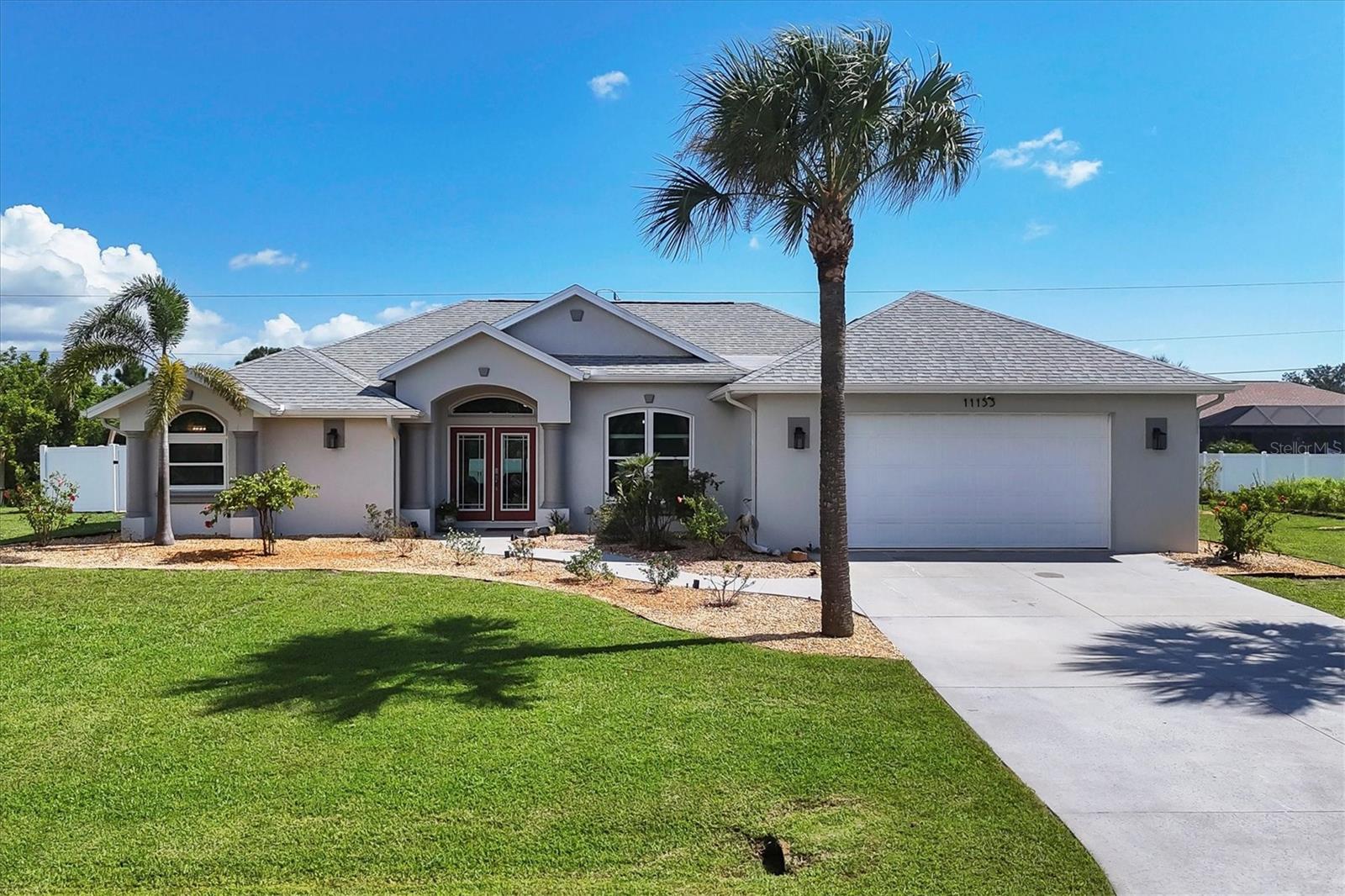 On three LOTS! This amazing pool home is centered on 2 lots PLUS a BONUS LOT featuring a shed with roll up doors and electric as well as a driveway, perfect for RV (RV outlet too) or Boat parking. No flood insurance required. NO HOA fees. Newer hurricane rated windows, sliders and doors. 2 of the bedrooms, living room and dining room have pocket sliding doors that fully open to the pool area. 70" TV and beautiful fireplace in living room. Pool area has LOTS of room and an outdoor shower. Back yard is fully fenced with a separate dog run. Separate air conditioned storage room in garage, Rainbird irrigation system with newer well pump, whole house surge protection, solar cover for heated salt water pool, 2020 roof, 2025 water heater, 2020 A/C, septic pumped 2025, fresh paint inside/out. Only 15 min to the beaches! This home is gorgeous! Absolutely MOVE IN READY!