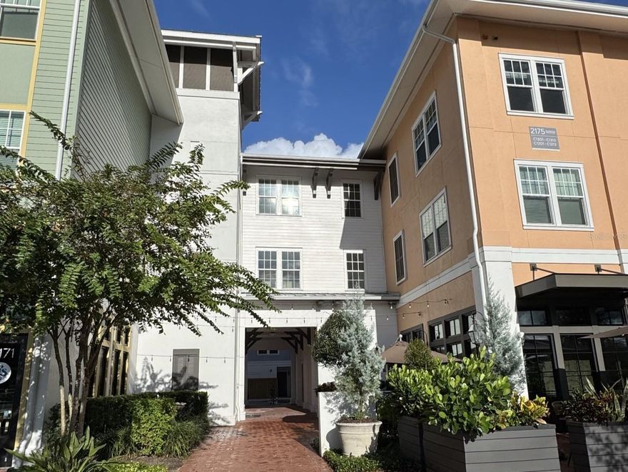 The all-new Colburn Apartment homes feature two home design scheme options; energy-efficient, stainless steel appliances; custom cabinetry with under-cabinet lighting and designer hardware; granite countertops; French-door refrigerators with water/ice dispensers; deep-soaking, garden-style bathtubs; expansive kitchen islands with pantry storage; designer kitchen tile backsplashes; undermount sinks with gooseneck faucets; designer kitchen pendant lighting; wood-style flooring; integrated Sonos® sound systems; keyless home entry systems; 10-foot ceilings; built-in desks; spacious walk-in closets; walk-in, glass-door showers with rainfall showerheads *; double-sink vanities *; bedroom ceiling fans and private patios and balconies. *Only available in select homes. The Colburn amenities include a resort-style pool, outdoor resident lounge, resident clubhouse with a European pantry and tea room, lakeside walking trails, resident maker’s studio, fitness center with yoga/spin studios, adventure playground, bike storage and repair room, planned resident social events, additional outdoor storage available, 24/7 package lockers, access to all celebration amenities, level 1 EV charging stations *, 1st floor retail, dog grooming spa, private conference room, bike storage and repair room, pet-friendly community, planned resident social events, smoke-free community, modern lighting. Residents of the new Colburn Apartments in Celebration, FL, will enjoy convenient access to a variety of nearby shopping areas. These include Celebration Town Center, the Orlando Vineland Premium Outlets, as well as grocery stores such as Target and Publix. At The Colburn, all essential shopping needs can be easily fulfilled. The Colburn offers a diverse array of dining options for residents to explore and enjoy. Near our luxury apartments in Celebration, FL, there are reputable establishments such as Eleven, Trevi's Restaurant, and 7592 Chophouse. At The Colburn, the selection of dining experiences is extensive and varied. The Colburn Apartments also offer proximity to cultural and artistic activities, theme parks and so much more! Price listed is for 15-month lease. Other terms are available. Pricing and availability subject to change without notice.