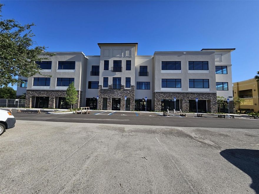 Modern office suite in Village Park at Hunters Creek. Unit #O-335 is a spacious, open-plan unit filled with/ natural light & a great view! Features laminate floors & a kitchenette (option to add fridge/cabinets). This professional building offers secure keypad access, an elevator, shared restrooms, & ample parking. Directory/door space for your business name. Prime Orlando location with/ excellent visibility. Close to Hwy 417, MCO Airport, Lake Nona & Medical City. Ideal for professional, corporate, legal, financial, tech, or creative firms. All leases are subject to the Assn. Approval. Schedule a tour!