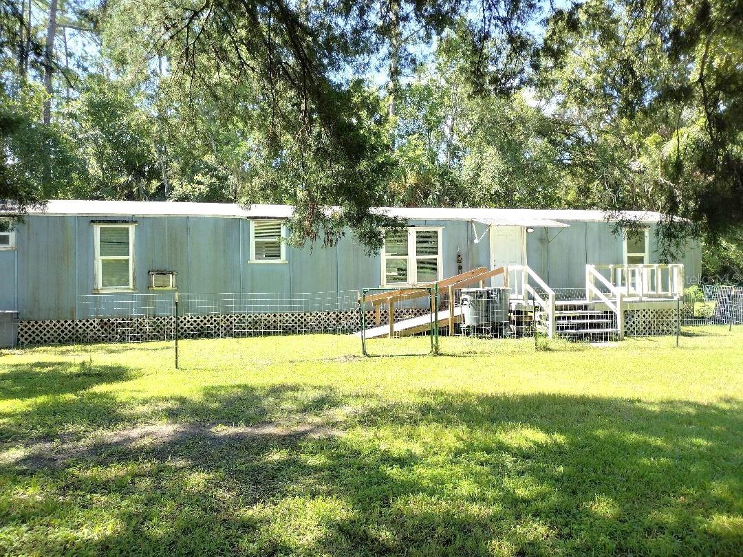 Enjoy country living in this 3-bedroom, 2-bath single wide mobile home situated on a 135x334’ cleared county lot. With no HOA restrictions, there’s plenty of room for your farm animals, work trucks, RV, or other recreational toys. The property offers a peaceful rural setting while still being within a short drive to shopping, dining, and major highways. Whether you’re looking for a primary residence or a weekend retreat, this home provides space, flexibility, and the freedom to live your way.