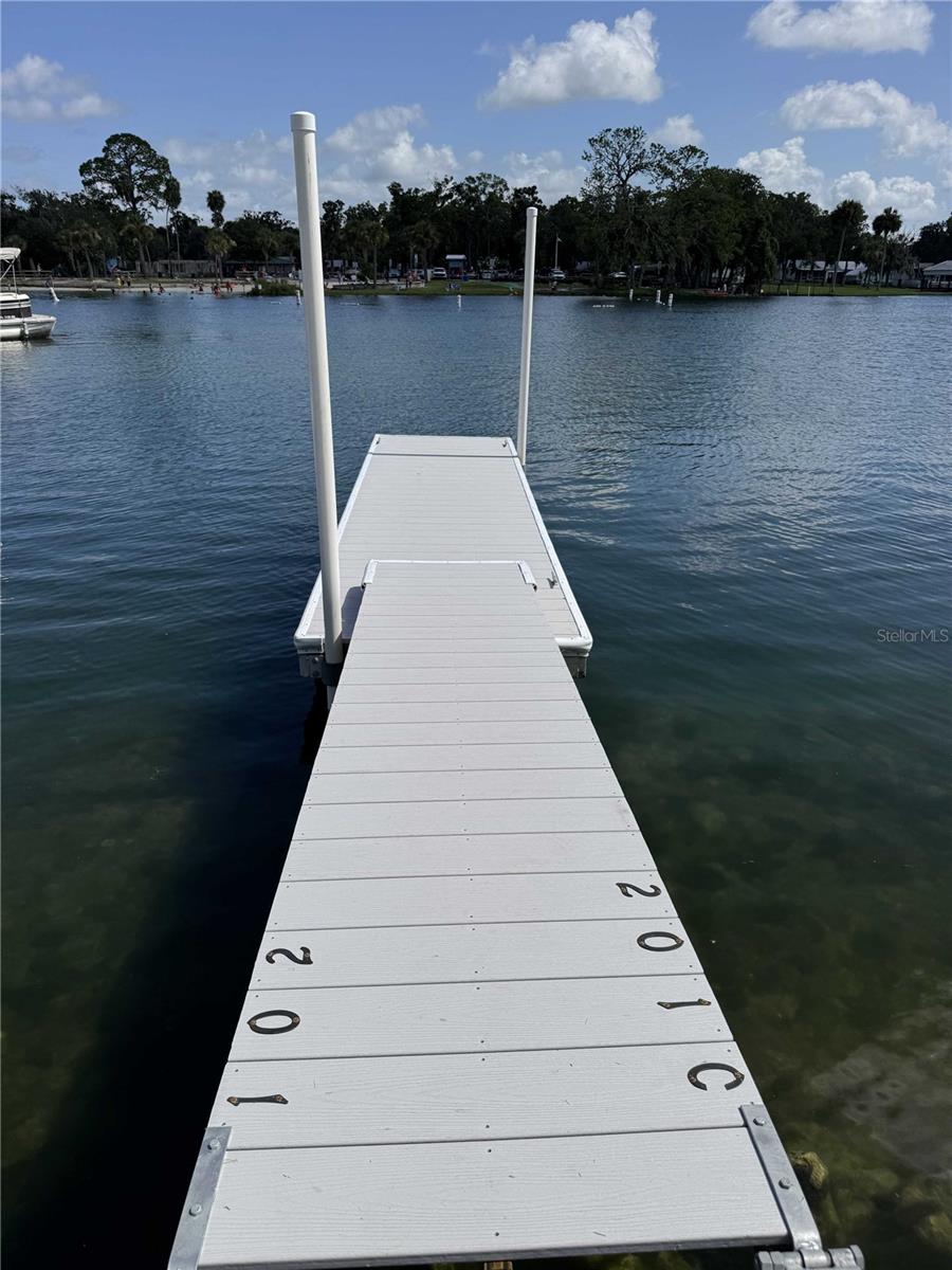 We wanted to share some exciting news about a newly available property that I believe offers the ultimate Florida lifestyle: a waterfront condominium on Hunter Spring Run in Crystal River, Florida. This 2-bedroom, 2-bath unit is ideally situated directly on the picturesque Hunter Spring, providing stunning water views.
Inside, you'll find modern amenities including luxury vinyl plank (LVP) flooring, granite countertops, and a contemporary kitchen. The private paver patio offers a serene space to enjoy the waterfront scenery. For boating and nature enthusiasts, a personal boat slip provides effortless access to the Gulf and the breathtaking natural beauty of three nearby springs. Additionally, there's dedicated kayak storage, perfect for exploring the crystal-clear waters right from your doorstep. The community also offers a maintained pool on the property for residents to enjoy. This property has been recently renovated after experiencing flooding during Helene in 2024, ensuring it's in excellent condition.