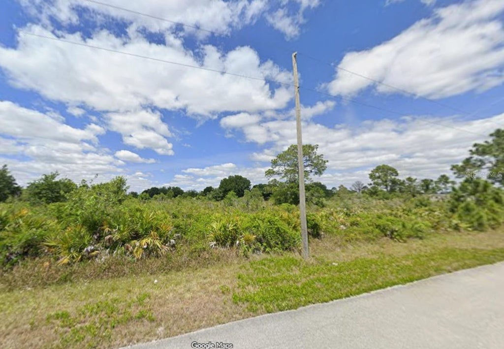 Photo of 647 Corsica Avenue NE, Lake Placid, FL 33852 (MLS # O6451952)