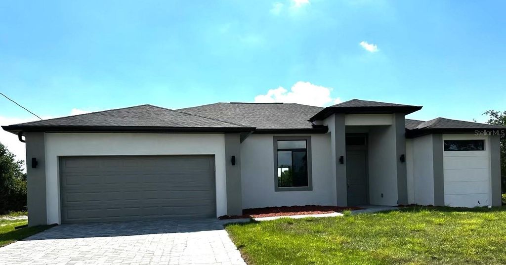 Photo of 318 Radford Avenue, Lehigh Acres, FL 33974 (MLS # O6384708)