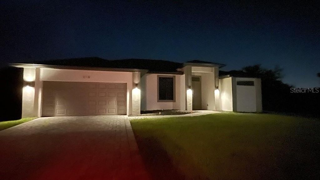 Photo of 318 Radford Avenue, Lehigh Acres, FL 33974 (MLS # O6384708)