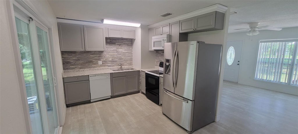 Photo of 1965 Manor Way, Deland, FL 32720 (MLS # V4950330)