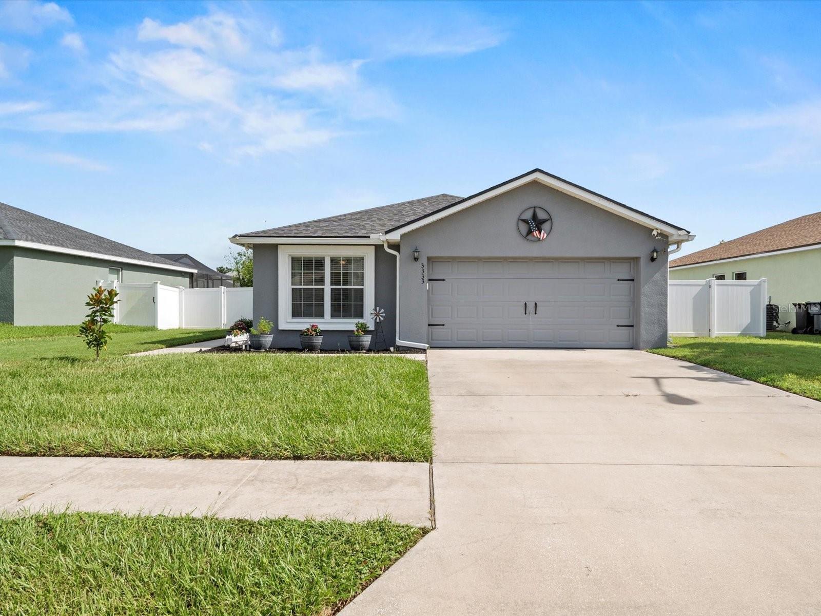 USDA financing available! Escape the cramped subdivisions and discover this STUNNING MOVE-IN READY 3 bedroom, 2 bath home that offers the perfect blend of modern updates and peaceful living! Situated on a SPACIOUS LOT with a large FENCED BACKYARD, this meticulously maintained property boasts gorgeous luxury vinyl plank flooring throughout, a beautifully updated kitchen with newer stainless steel appliances, and a BRAND NEW ROOF for your peace of mind. The impressive 2-car garage features fresh epoxy flooring, while the expansive backyard showcases new vinyl fencing and includes a convenient storage shed. Inside, you'll love the open-concept living area that flows seamlessly into the spacious kitchen and dedicated dining space. The thoughtful split bedroom layout provides privacy with the master suite positioned at the rear and two additional bedrooms at the front of the home. Garden enthusiasts will be thrilled with the established landscaping and gardens - this truly is a GARDENER'S PARADISE! With all these updates and nothing left to do but unpack, this exceptional home won't last long in today's market. Schedule your private showing today and prepare to fall in love!