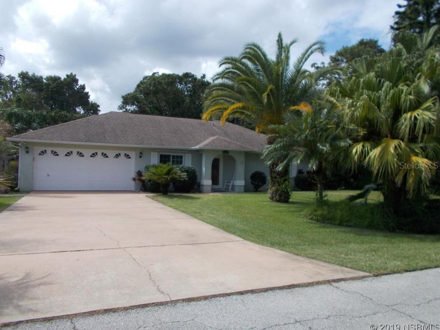 "Lovely, Must See 3 br/2 ba Block Home with Amazing Heated 15x45 Lap Pool". Welcome to a tropical oasis with a covered lanai and brick-paved deck overlooking the massive in-ground solar heated salt water pool. Completely fenced in private backyard with outdoor shower, mature landscaping a 2 storage sheds (one with electricity). Additional outdoor space includes a covered tiki bar with sound system and mini fridge. High ceilings, open living areas, remodeled bedrooms, newer flooring, 2018 A/C. Other amenities include a sprinkler system, sunroom, well-designed laundry/utility room. One mile to shopping plaza, 15 minutes to the sandy Atlantic beaches. Step inside this beautiful living space, be impressed and want to call it home! ;Water: City