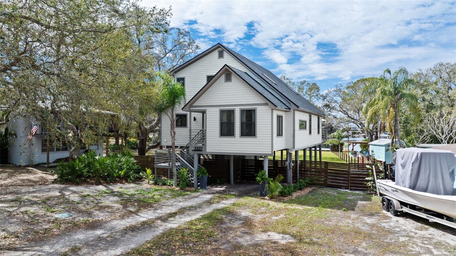 Waterfront Stilt Home in Bailey’s Bluff, FL – Fully Remodeled!
3327 Pineview Dr, Holiday, FL 34691
3 Bedrooms | 2.5 Bathrooms | 1,790 Sq. Ft. | Under-House Parking
Live the ultimate Florida waterfront lifestyle! This stunning stilt home in the highly sought-after Bailey’s Bluff community has been completely remodeled and offers direct Gulf of Mexico access! Designed for boating enthusiasts, sunset lovers, and those seeking a welcoming, coastal neighborhood, this move-in-ready home blends modern upgrades with breathtaking water views.
Fully Remodeled & Move-In Ready!
*Brand-New Roof (2024) – Enjoy worry-free living for years to come. New Drain Field (2024) – Major system upgrade completed.
*New Siding & Exterior Paint (2022) – Fresh, modern curb appeal. New External Stairs & Railings (2022) – Stylish & sturdy outdoor access. Enclosed Front Porch & Updated Entryway (2022) – Welcoming curb appeal.
*New Hurricane Impact Windows in Dining & Kitchen (2022) – Extra security & energy efficiency.
*New Expanded Deck & Floating Dock (2022) – Perfect for entertaining or launching your boat!
*Remodeled & Relocated Kitchen (2022) – Featuring luxurious Oceanaire Quartzite countertops, stainless steel appliances, and custom cabinetry. New Interior Paint (2023) – Fresh, neutral tones throughout. Newly Added Half Bath (2022) – Convenient for guests. Expanded *Laundry Room (2022) – More storage & functionality. Master Suite Upgrade (2023) – Includes a new walk-in closet & remodeled master bath.
* Thoughtful Design & Features:
* Cozy Electric Fireplace – Located in the living room for ambiance & warmth.
*Smart Lighting Throughout – Modern, energy-efficient, and customizable.
* Jack & Jill Bathroom – Conveniently connects the 2nd & 3rd bedrooms on the top floor.
* Master Suite on Main Level – Features sliding glass doors leading to stunning backyard sunset views over the water.
* Bailey’s Bluff – A Waterfront Community Like No Other!
Bailey’s Bluff is a tight-knit, Gulf-front community with just 130 homes, where neighbors become friends. Enjoy exclusive amenities, including:
* Private Community Clubhouse – Located on the open Gulf, available for residents at a minimal cost.
* Community Boat Ramp (One Street Away!) – Easy access to Gulf waters for boating & fishing.
* Breathtaking Sunsets – Experience stunning, unobstructed Gulf views from your own backyard.
* Incredible Nearby Attractions:
* Key Vista Nature Preserve – 0.5 miles
*Anclote Gulf Park – 1.4 miles
* Anclote River Park – 2.6 miles
* Tarpon Springs Sponge Docks – 5.7 miles
* Fred Howard Park Beach – 8.5 miles
* Downtown Palm Harbor – 11 miles
* Dunedin Causeway Beach – 16 miles
* Honeymoon Island State Park – 17 miles
* Clearwater Beach – 23 miles
* Boat & Marina Slip Available (Optional Purchase)
Interested buyers have the option to purchase a Sea Ray SPX 210 (21’6” bowrider boat with Mercury engine, ski tow attachment, and ski locker).
A hi/dry marina slip at Tarpon Landings Marina (5.3 miles from the house) is also available—these slips typically have a 2-year waitlist!
Experience the best of Florida living in Bailey’s Bluff! Waterfront, boating, sunsets, and a fully remodeled home—schedule your private showing today! The Sellers flood insurance is transferable