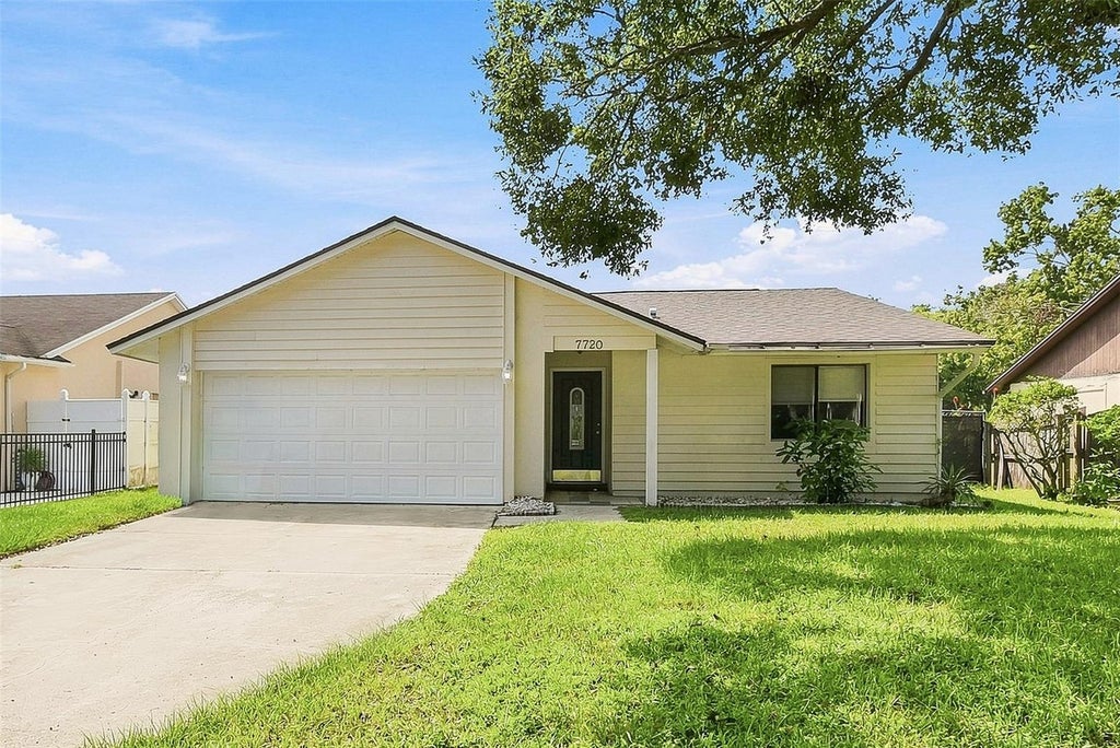 Photo of 7720 Lakeside Woods Drive, Orlando, FL 32810 (MLS # O6441808)
