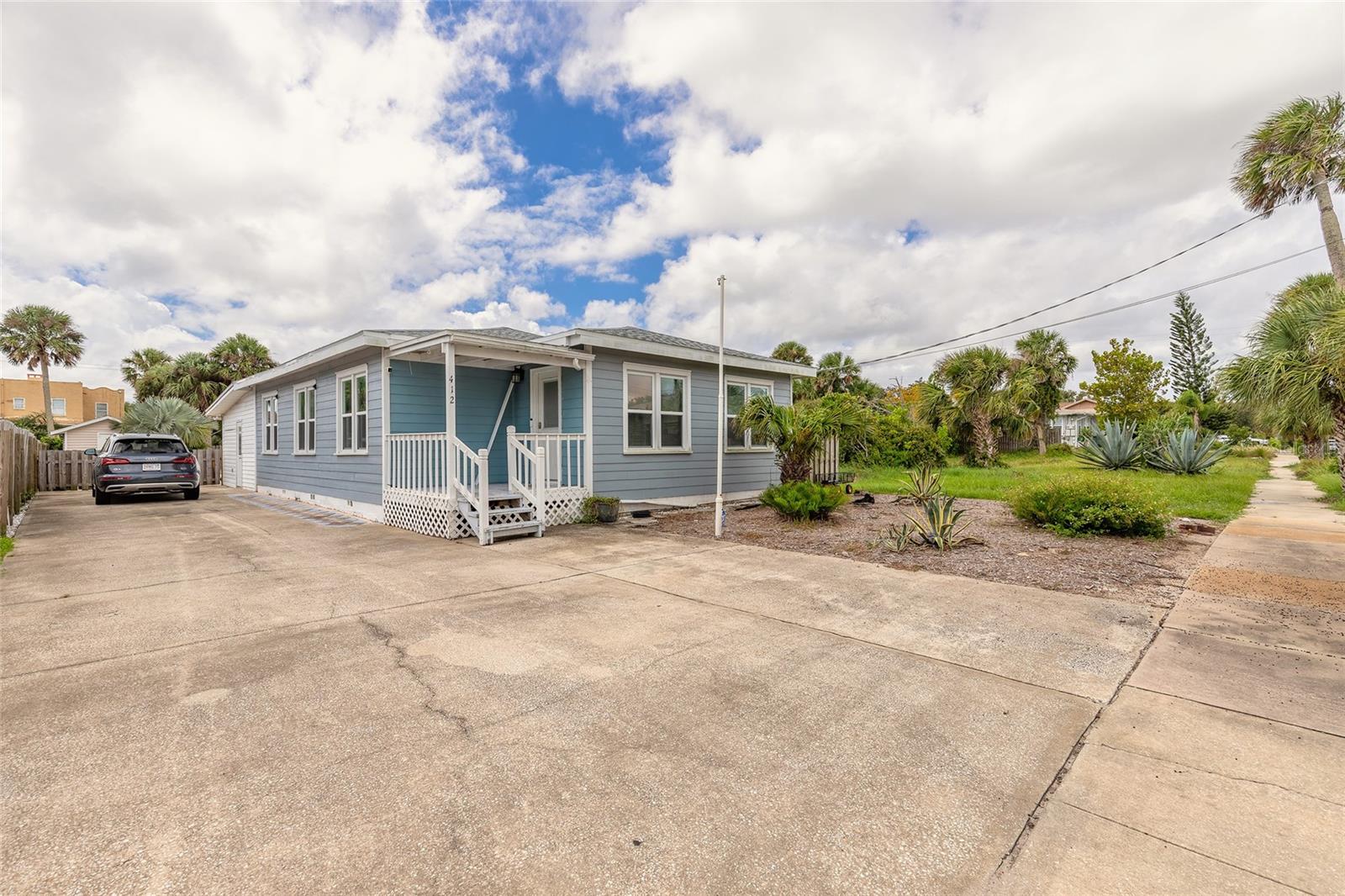 Discover this charming beachside bungalow at 412 Revilo Boulevard, just three blocks from the sandy shores. This 3-bedroom, 2-bath main home offers comfortable living space and sits on a deep 165 ft lot. Enjoy a private inground pool perfect for relaxing or entertaining. A detached 1-bedroom, 1-bath in-law suite provides ideal space for guests or potential rental income. With block construction, a brand-new roof & hot water tank (2024), this home combines classic charm with modern updates. Located near Sun Splash Park, Jackie Robinson Ballpark, and popular dining spots on Beach Street and Main Street Pier, this property is perfect as a quaint vacation getaway or smart investment opportunity in the heart of beachside Daytona Beach. All information is intended to be accurate, however not guaranteed.