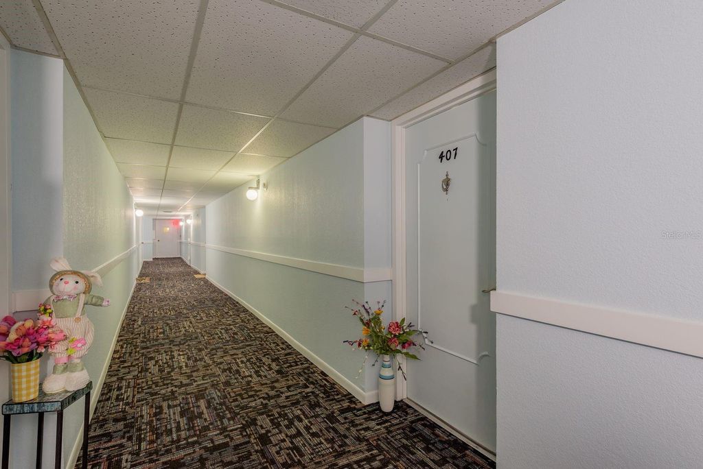 Photo of 10216 Regal Dr #407, Largo, FL 33774 (MLS # W7881679)