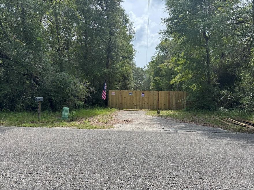 Gorgeous 2+ acre lot in a quiet Country setting, plenty of room for a homesite and bars. Agriculturally zoned so bring the animals. No deed restrictions paved road frontag, plenty of wild life including deer and turkey with a working well, septic tank and electric pole in a full fenced lot.