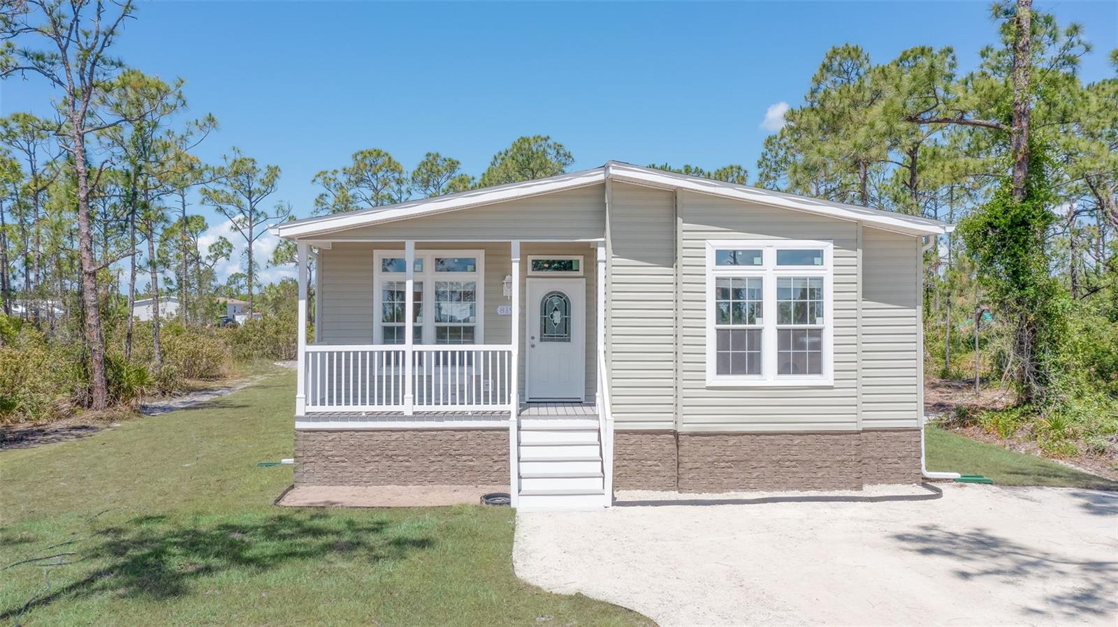 Enjoy a laid back country lifestyle in your new home in the Charlotte Ranchettes. This brand new Imperial Floor plan from Jacobsen Homes overlooks the Babcock Preserve, allowing you to enjoy wildlife, birds, and the serene sounds of the country while you enjoy your morning coffee on your new front porch - the perfect neighbors! As you enter the home with a stone facade - the open floor plan, cathedral ceilings, and windows allows the natural light to make the open space bright and airy - a perfect place for entertaining, family gatherings, or cozy nights relaxing. The 3rd bedroom or flex room is the perfect home office with the view of the preserve. The home has been constructed with an eye for detail and a stickler for doing things right from the Trex decked porch and stairs with vinyl railing to the full vinyl siding that encloses the crawl space with access doors, gutters around the entirety of the home, and fresh sod on the entire lot. Home has a double driveway with a culvert and underground electric. Enjoy the freedom and diversity of the Agriculture zoning which allows you to own livestock, chickens, farms etc - if self -sustainability or enjoying farming / gardening is your goal - this is your place! For a night out, explore local dining options within a 10 minute drive in Downtown Punta Gorda. Shopping and entertainment are conveniently close with Fishermen’s Village offering unique boutiques, waterfront dining, and frequent events. Travel is a breeze with easy access to Punta Gorda Airport and Southwest Florida International Airport with ease of access to I75 with 2 on/off ramps less than 10 minutes away. Imagine starting each day with a cup of coffee on your porch, the sound of nature around you, and endless opportunities for adventure and relaxation just moments away. ** Property consists of (2) .63 acre parcels and can be purchased for $329,000 with the single lot. The second lot does have a permit for a second home to be constructed, if that is the buyers wish. **