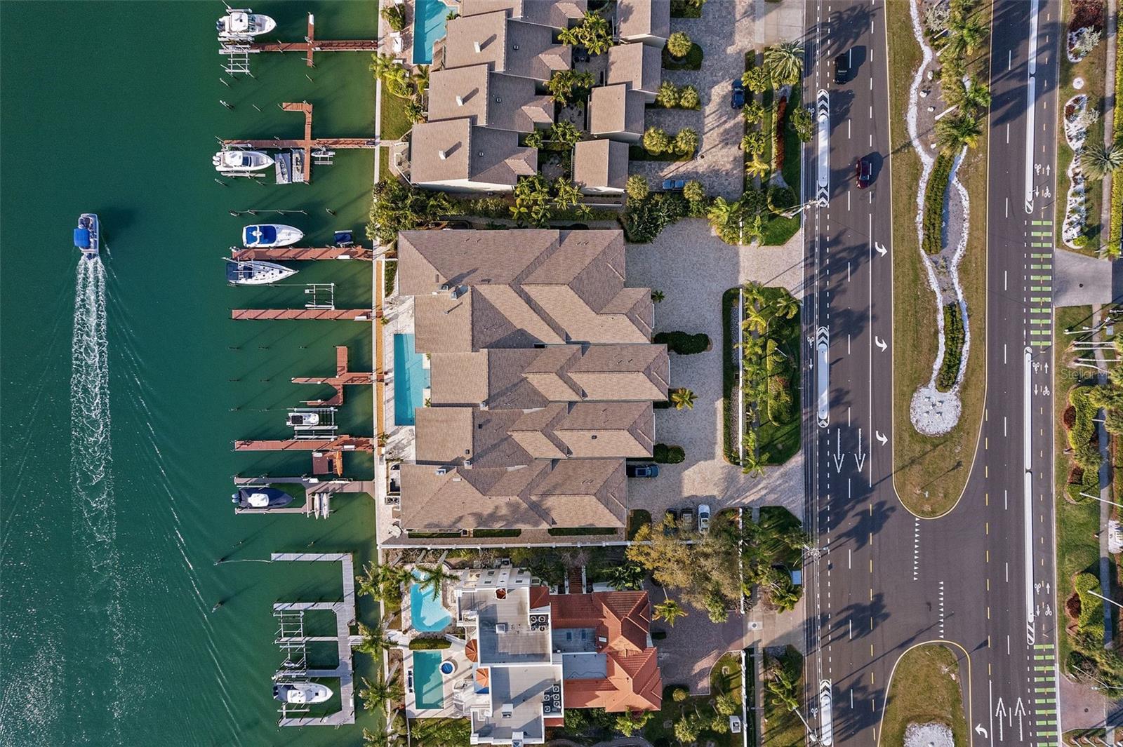 Stunning Waterfront Townhome had NO HURRICANE DAMAGE. Features TWO DEEP-WATER BOAT SLIPS!
Experience the epitome of modern coastal living in this luxurious townhome in Angler’s Wharf, situated on the stunning island of Tierra Verde. With direct water views overlooking the Grand Canal, direct access to the Gulf of Mexico and Tampa Bay, this exclusive community of only 5 homes offers an unparalleled sense of tranquility and sophistication. Boasting 5 bedrooms, 3 and ½ baths, plus a spacious office, bonus room, and craft room that could easily transform into a Butler’s pantry, this residence exudes spaciousness and versatility. The grand living room welcomes you with high ceilings, abundant natural light, a wood-burning fireplace, and a full wet bar complete with an ice maker, wine refrigerator and bar refrigerator. Entertain guests in the separate dining room, ideal for intimate dinners or formal gatherings. The gourmet kitchen exceeds expectations with quartz countertops, ample storage space, and top-of-the-line appliances including a double oven and trash compactor. A long breakfast bar allows for seamless interaction while preparing meals. Step outside to the patio and poolside area, perfect for al fresco gatherings while enjoying views of the canal and marine life passing by. Retreat to the primary bedroom oasis featuring a large en-suite bath, two private balconies overlooking the water, and access to two boat slips and the community pool. Work from home effortlessly in the spacious office with bamboo flooring, or utilize the flexible layout to accommodate a large family or in-law suite with separate entrance and staircase. An attached oversized garage with workshop provides ample storage space for vehicles and more. Enjoy the waterfront lifestyle with two boat slips, one with a lift and the other with a floating dock, water, electric, and a fish cleaning station. Conveniently located near Fort DeSoto Park/Beach and St. Pete Beach, indulge in various dining options and year-round community events, all while being just minutes away from the vibrant city life of downtown St. Petersburg. Embrace the laid-back yet vibrant lifestyle of Tierra Verde, where every day feels like a retreat.