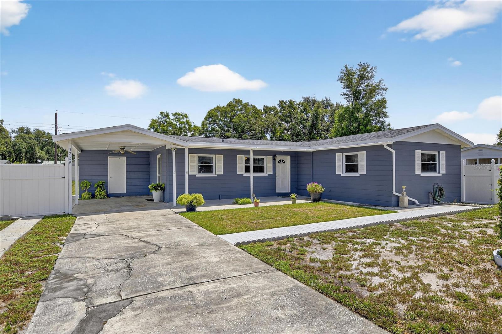 Welcome to 4729 Ron Circle, a charming home nestled in a quiet Lakeland neighborhood. From the moment you arrive, you’ll notice the curb appeal — the exterior has been freshly painted, and the sellers have thoughtfully added new concrete driveways and walkways, creating a clean and inviting look. In addition, the roof is only two years old, giving buyers peace of mind for years to come. Step into the backyard and you’ll find one of the home’s highlights: a spacious covered lanai, perfect for hosting barbeques, entertaining friends, or simply relaxing outdoors year-round. Beyond the lanai, the massive backyard offers endless possibilities — from gardening and play areas to creating your own private retreat. This peaceful community provides the tranquility you’re looking for while still keeping you close to shopping, dining, and major roadways. As a bonus, the sellers are offering buyers the option to keep the paid-in-full solar panels located in the backyard. They do require installation, but once in place, they could provide great long-term energy savings.