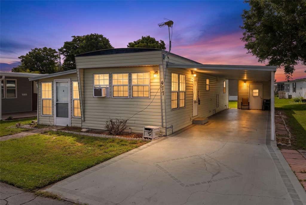 Photo of 477 Marina Lane, Tavares, FL 32778 (MLS # O6434207)