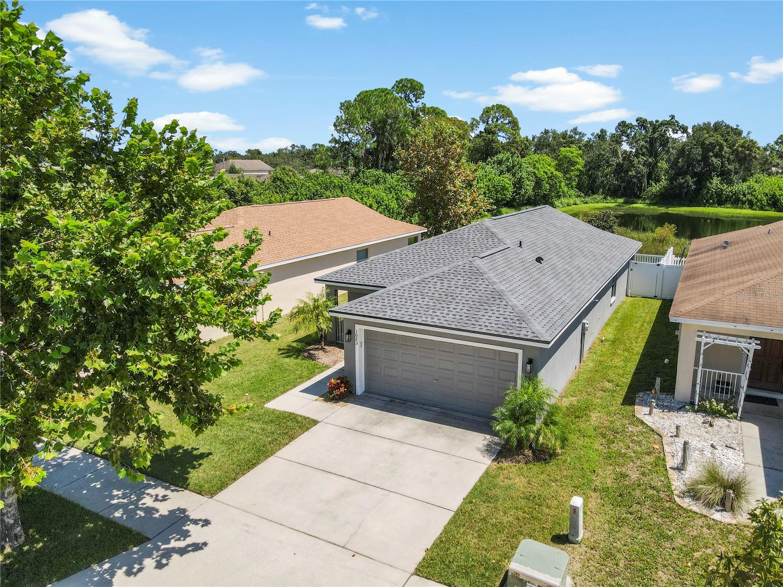 Beautiful Home with Lake & Preserve Views in a Flood Zone X500 with low HOA with no CDD fees—a rare find! Welcome to this charming 3-bedroom, 2-bathroom single-family home in a peaceful Ruskin community. Thoughtfully updated and move-in ready, this home offers modern finishes and tranquil surroundings. Inside, you’ll find an inviting open layout with luxury vinyl plank flooring installed (2021/2022) and a stylish kitchen featuring granite countertops including modern appliances. The spacious living and dining areas flow seamlessly, creating the perfect setting for everyday living or entertaining. The primary suite and additional bedrooms provide comfort and flexibility for family or guests. Recent updates include a brand-new roof (2025) with a transferable warranty, HVAC (2017), Hot Water Heater (2017), and exterior of home painted (2021). Hurricane shutters are also included and stored in the garage for peace of mind. Step outside to your private backyard patio overlooking a serene lake and preserve, with no backyard neighbors. This is the ideal space to relax and enjoy the natural beauty. Located near E.G. Simmons Park, Little Manatee River State Park, Bahia Beach Nature Preserve and waterfront dining at Sunset Grill. This home also offers quick access to I-75 and US 41 for easy commutes to Tampa, St. Pete, and Sarasota / Bradenton. Don’t miss your chance to call this Ruskin retreat your new home. Schedule your showing today!
