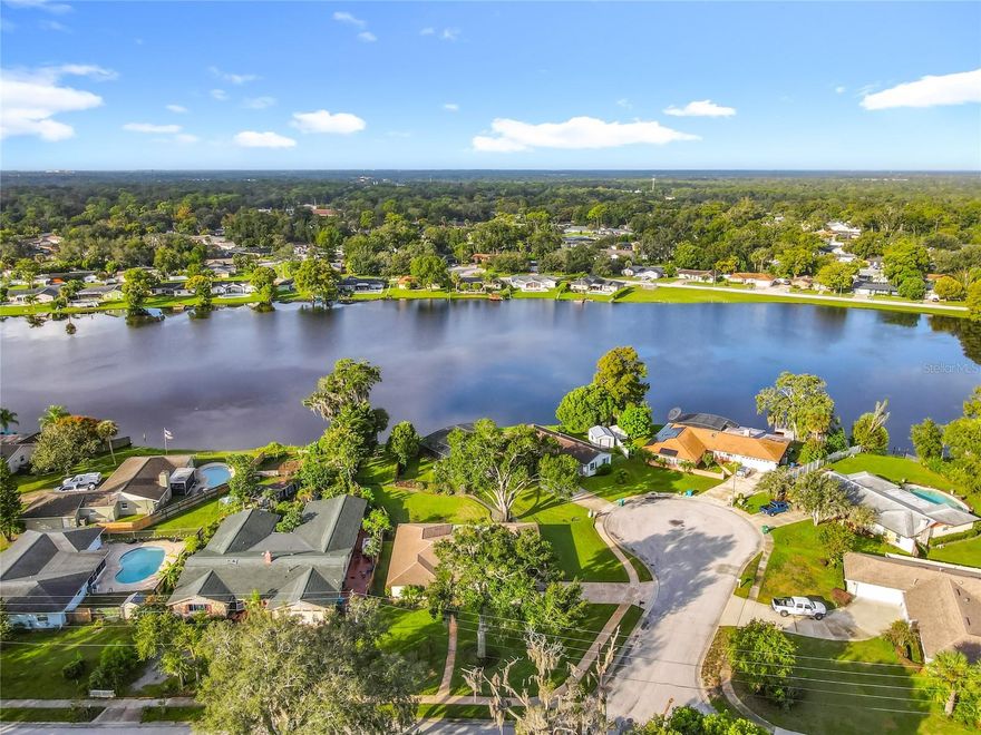 Tucked away in the beloved Winsor Manor community, this one-owner lakefront home has been lovingly cared for since the day it was built. For over four decades, it’s been a place where family gatherings, quiet mornings, and laughter by the lake filled the days—now ready for its next chapter.

Set on a beautiful 1/3-acre corner lot overlooking Lake Winsor, this 4-bedroom, 3-bath concrete block home was designed for everyday comfort and easy Florida living. The screen-enclosed patio invites you to relax while taking in peaceful water views, and the fenced backyard—installed for child safety—extends beyond the iron fence all the way to the lakefront.

Inside, you’ll find 2,051 square feet of well-planned space, featuring formal living and dining rooms, a welcoming family room adjoining an eat-in kitchen, and a convenient split-bedroom layout perfect for privacy. A spacious inside laundry room and pool bath add to the home’s functionality.

While well-maintained and move-in ready, the home offers an opportunity for its next owner to update and make it their own, reflecting today’s style while preserving the craftsmanship and pride of ownership evident throughout.

Major systems have been thoughtfully updated over the years:

New electrical panels

Roof (2012) with CertainTeed Landmark Lifetime shingles, inspected after the 2023 hurricane (no damage) and professionally washed and sealed

Natural gas central heat and tankless gas water heater

Lightning protection system (2012) with three grounds

Sprinkler system (2014) using lake water via a 3-year-old pump, providing lush landscaping with cost savings

Beyond its features, 225 Slade Drive offers something you can’t replicate—a sense of community and a connection to nature, all within the top-rated Seminole County School District. Whether you envision paddleboarding at sunset, coffee on the lanai, or watching little ones grow up by the lake, this home is ready to be the backdrop for new memories.

Come discover the timeless appeal and potential of this cherished Winsor Manor residence—a true Longwood gem, first time ever offered for sale.