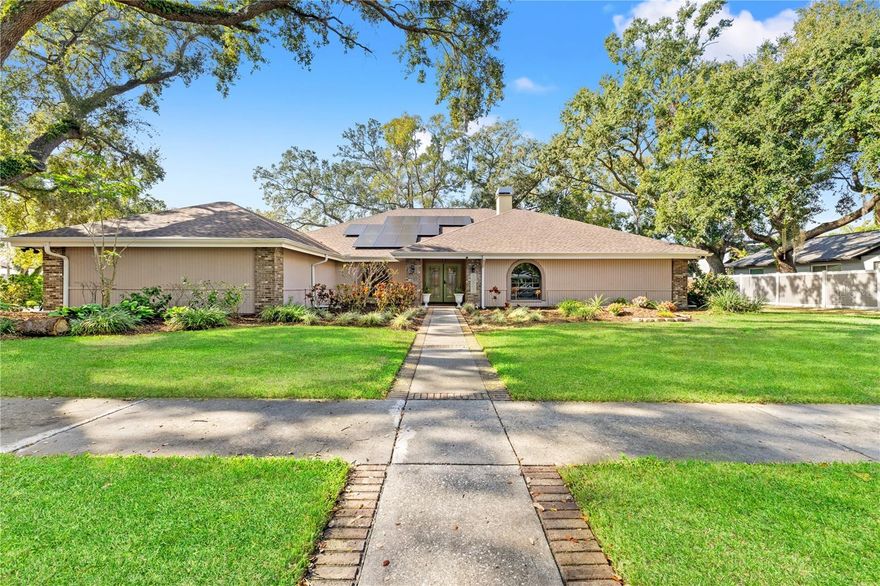Original Carrollwood GEM with high ceilings and access to Lake Carroll and the community beach!  Welcome home to this sprawling 1989 ranch featuring soaring ceilings, a desirable split floor plan, and over 3,100 square feet of living space. A formal entryway welcomes you, and immediately to the right, you’ll find a light and airy living room with a dual-sided wood-burning fireplace.  The home offers a formal dining room and a bright, spacious kitchen located just off the family room, with double sliders leading to a large covered patio—perfect for indoor-outdoor living. The split floor plan provides exceptional privacy, with the primary suite tucked away on one wing of the home, offering generous space and storage. Two additional bedrooms are located on the opposite wing, along with a large laundry room, hallway linen closets, and a spacious pool bath with a shower.  The backyard is an entertainer’s dream, featuring a saltwater pool, separate spa, and a screened-in covered patio area. Enjoy raised garden beds, gather around the stone fire pit, or relax in your whimsical backyard beach area. The fully fenced yard offers privacy with no rear neighbors. When the night-blooming jasmine comes alive, the sellers have hosted unforgettable jasmine parties, filling the air with intoxicating fragrance and cherished memories.  This home has been lovingly maintained, with major updates including a new roof (2024), gutters (2023), HVAC system (2023), rescreened lanai (2024), and a stone fire pit (2024), plus much more. Own an electric vehicle? You’ll love the Tesla charger with adapters, along with solar panels that help keep electric bills low.  The Original Carrollwood location is unbeatable—offering quick access to shopping, dining, local parks, the community farmer’s market, Raymond James Stadium, and downtown Tampa. Plus, you can walk to Foxtail Coffee for your morning coffee.  This home is truly ready for you.