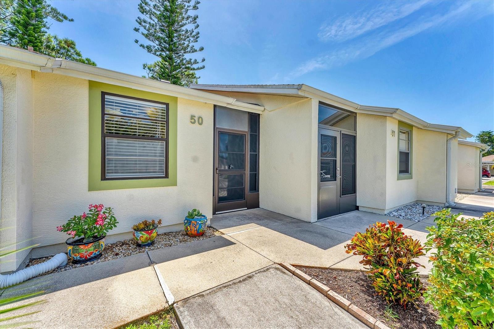 Welcome to peaceful Wildflower Village! This beautifully maintained condo radiates pride of ownership with its neat, clean, and comfortable feel. The well-appointed layout offers both functionality and charm, making it an inviting space to call home. A few added features include a pull down attic access and rerouted plumbing piping above ceiling. Nestled in a quiet community yet conveniently close to Gulf beaches, premier fishing spots, world-class golf courses, shopping, dining, and entertainment, this property blends relaxation with everyday convenience. Whether you’re seeking a full-time residence, a vacation retreat, or a smart investment, this gem checks all the boxes. Welcome to Paradise!