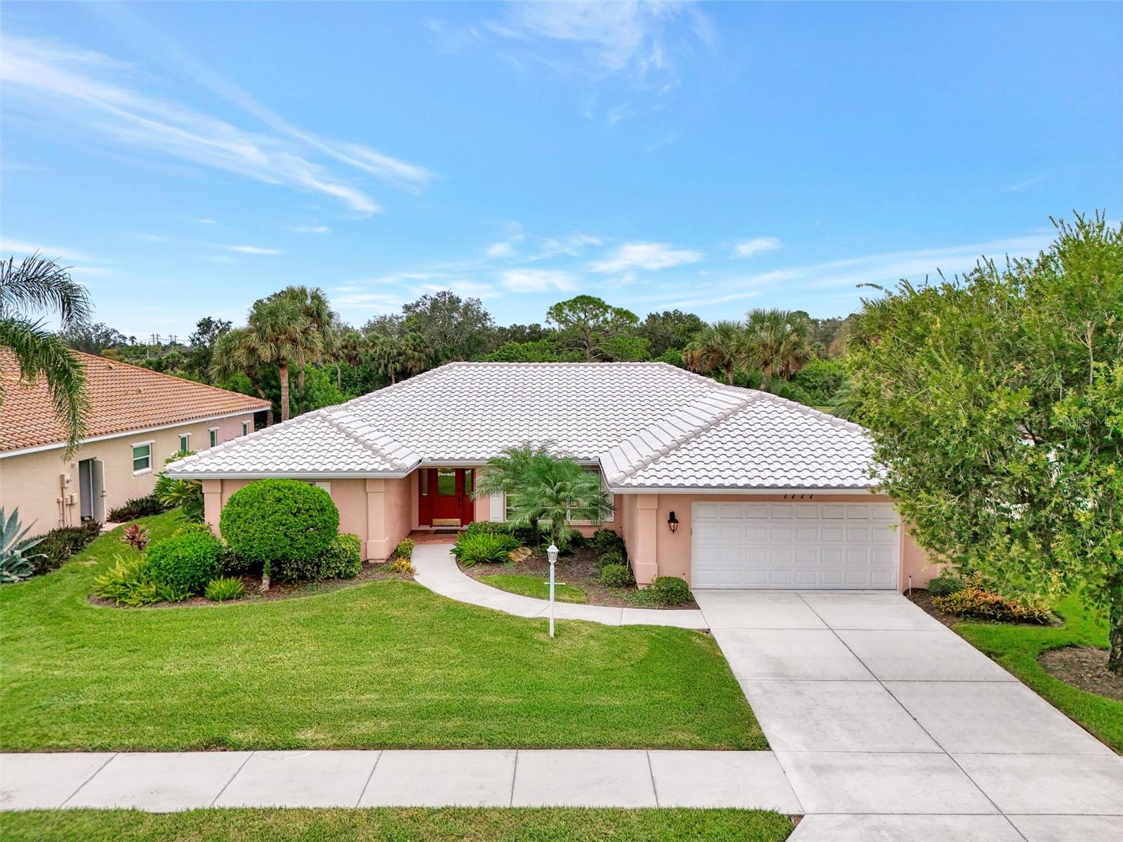 Attractive three bedroom, two bath, pool home, with golf course views in desirable Waterford Golf Community. The home features the "Great Room" floor plan. Very open and airy, with cathedral ceilings in your living room and kitchen. You have pocket sliding doors from the living room to your large, brick paver lanai (45X11), where you can really open up the backside of your home. There are tile floors throughout the home. The kitchen has been remodeled with granite counter tops and wood cabinets. The master bedroom has two walk-in closets and also has pocket sliders out to the lanai. The master bath has also been remodeled with newer shower stall, vanity and garden tub. The home is being offered partially furnished and has been well taken care of and in move-in ready condition. The roof was replaced in 2016 and the AC system was replaced in 2018. Be a part of this great community where golf membership on the 27 hole championship course is voluntary. The Waterford community amenities include a large heated pool and spa, clubhouse, fitness room and tennis courts. New pickleball courts are coming very soon! Come and see this beautiful home today!