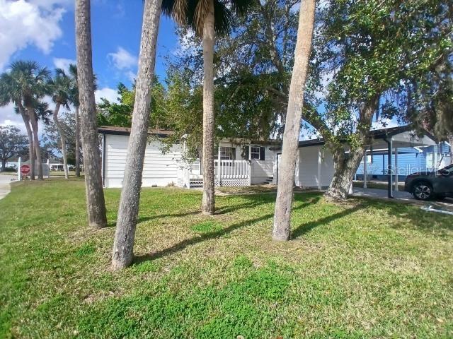 This double wide tenant occupied on large cul-de-sac lot in this exciting 55+ robust community. Everything is new!! Spacious living room opens to a large kitchen and dining area that is more than ample space to entertain. All new flooring, paint and remodel of baths and kitchen is just the start of the massive renovation that has been completed. The community offers a pool, clubhouse, fitness area and more. Golf carts and small pets are allowed.24-hour guard at this lovely, gated community. Great investment opportunity!