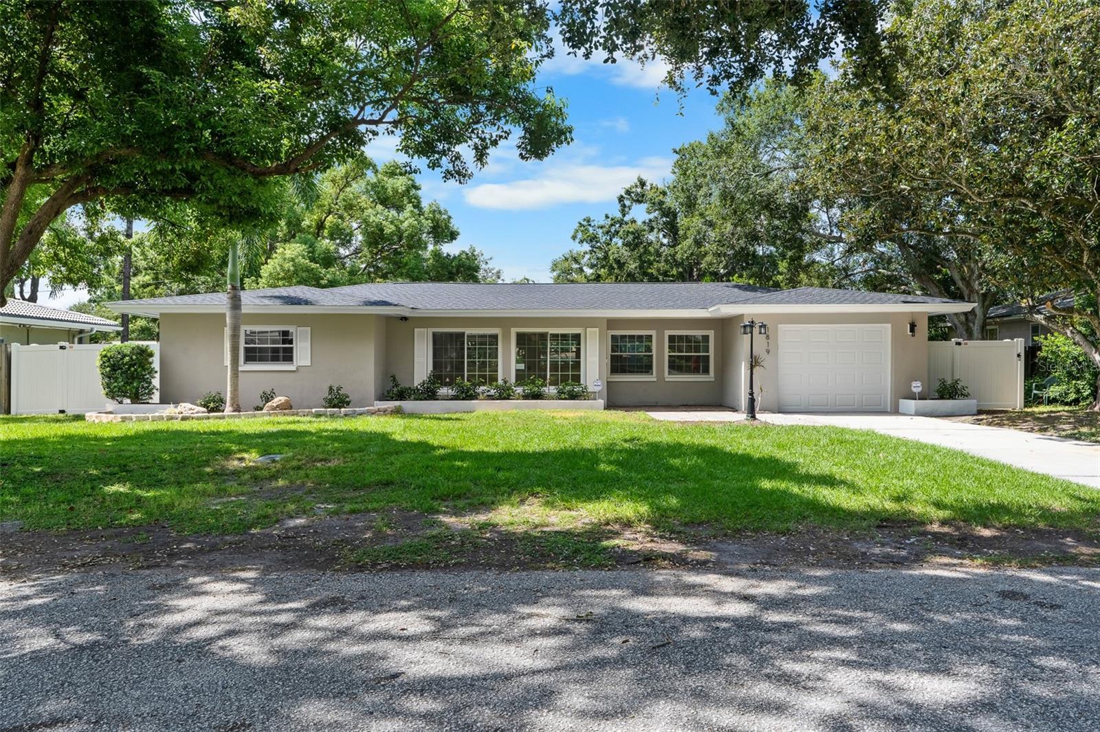 One or more photo(s) has been virtually staged. Welcome to 1861 Meadow Ln, a fully renovated 2-bedroom, 2-bath concrete block home in unincorporated Clearwater. Located in a great neighborhood with wide streets, friendly neighbors, and a safe, quiet setting just off Keene Road, this home has it all. Major upgrades include a brand-new roof, tankless water heater, and garage door (2025), newer windows, newer HVAC, full fumigation, and new attic insulation. Inside and out, the home has been freshly painted with premium Sherwin-Williams paint. One car garage. The interior features updated ceramic tile and vinyl flooring, recessed lighting, ceiling fans, and all-new doors and hardware. The kitchen and baths have been fully remodeled with real wood cabinets, granite countertops, stainless steel appliances, and modern fixtures. Enjoy a huge front yard and a large I fenced backyard with brand-new PVC privacy fencing and fresh landscaping, epoxy-finished garage adds extra polish. With transferable 4-point and wind mitigation reports and no HOA, this move-in ready home is a must-see in a prime Clearwater location. Unincorporated Pinellas County bring your boat or RV RV hook up in backyard.